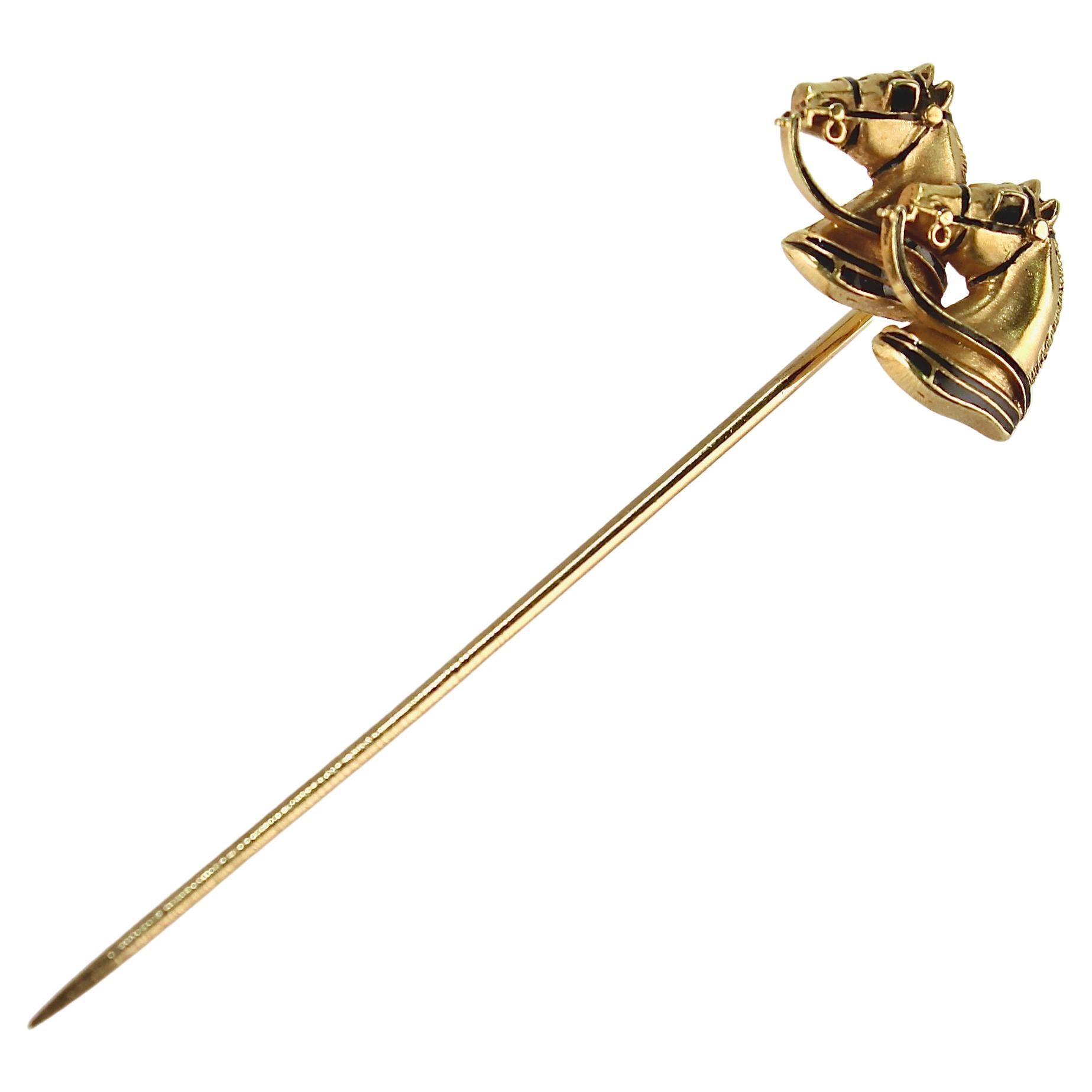 A very fine vintage equestrian stickpin. 

In the form of two 14k gold horse heads with black enamel accents in their blinders, harness and collars.

Simply a great stickpin!

Date:
Early to Mid 20th Century

Overall Condition:
It is in overall