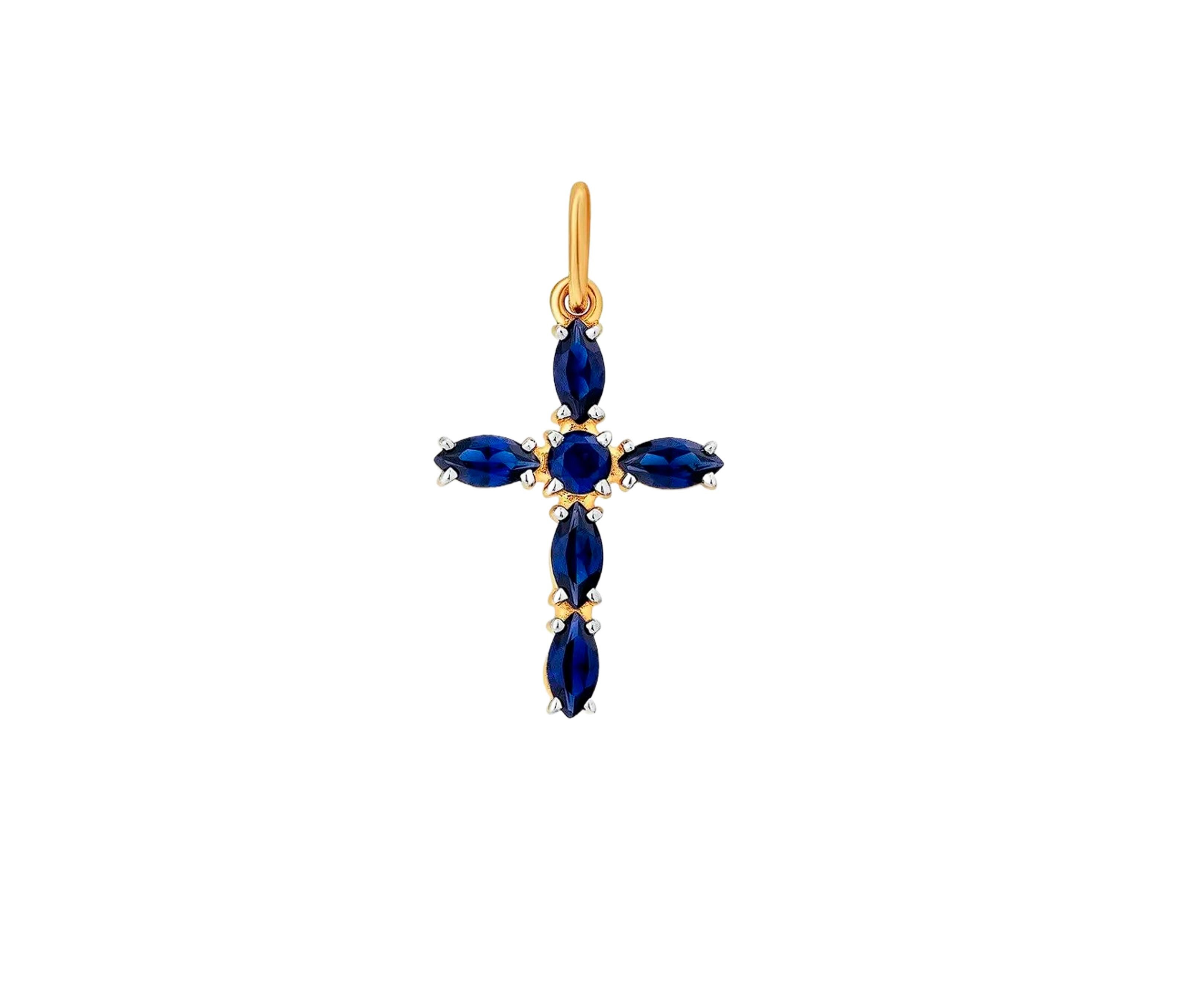 14k gold blue gemstones cross pendant. Lab sapphires cross pendant. Marquise blue lab sapphires cross pendant. 

Metal: 14k gold 
Weight: 1.2 gr.
Pendant size: aprox 22x12mm

Gemstones:
Lab sapphires, blue color, round cut (1 pieces, 2.7