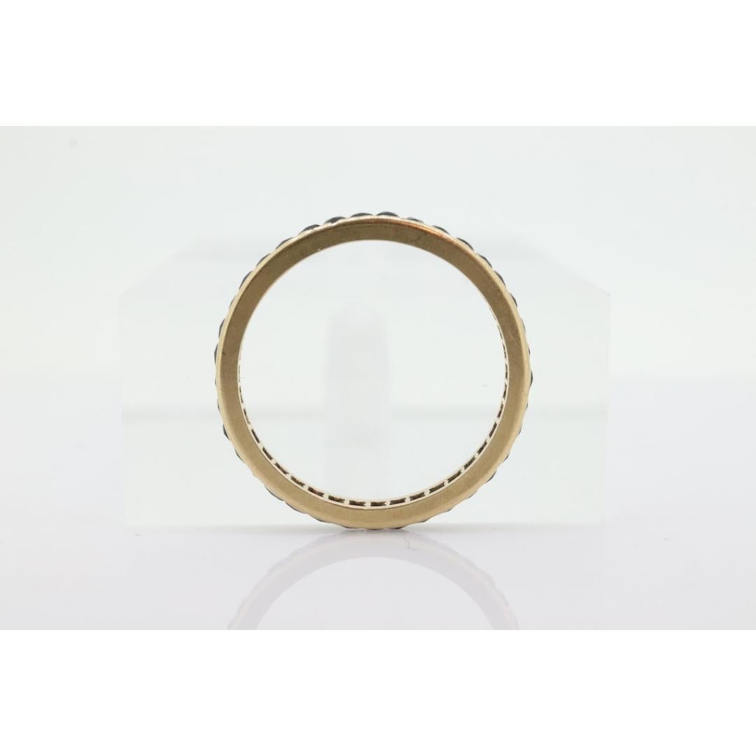 Vintage from the 1980s
Size: 5 1/2 US
Materials: Gold
Gemstone: Sapphire
Gem color: Blue
Band color: Yellow

Style: Minimalist

About this item

Blue Sapphire Full Eternity Band.

Channel set Princess cut sapphires.

Details:
Sapphires 1.5mm