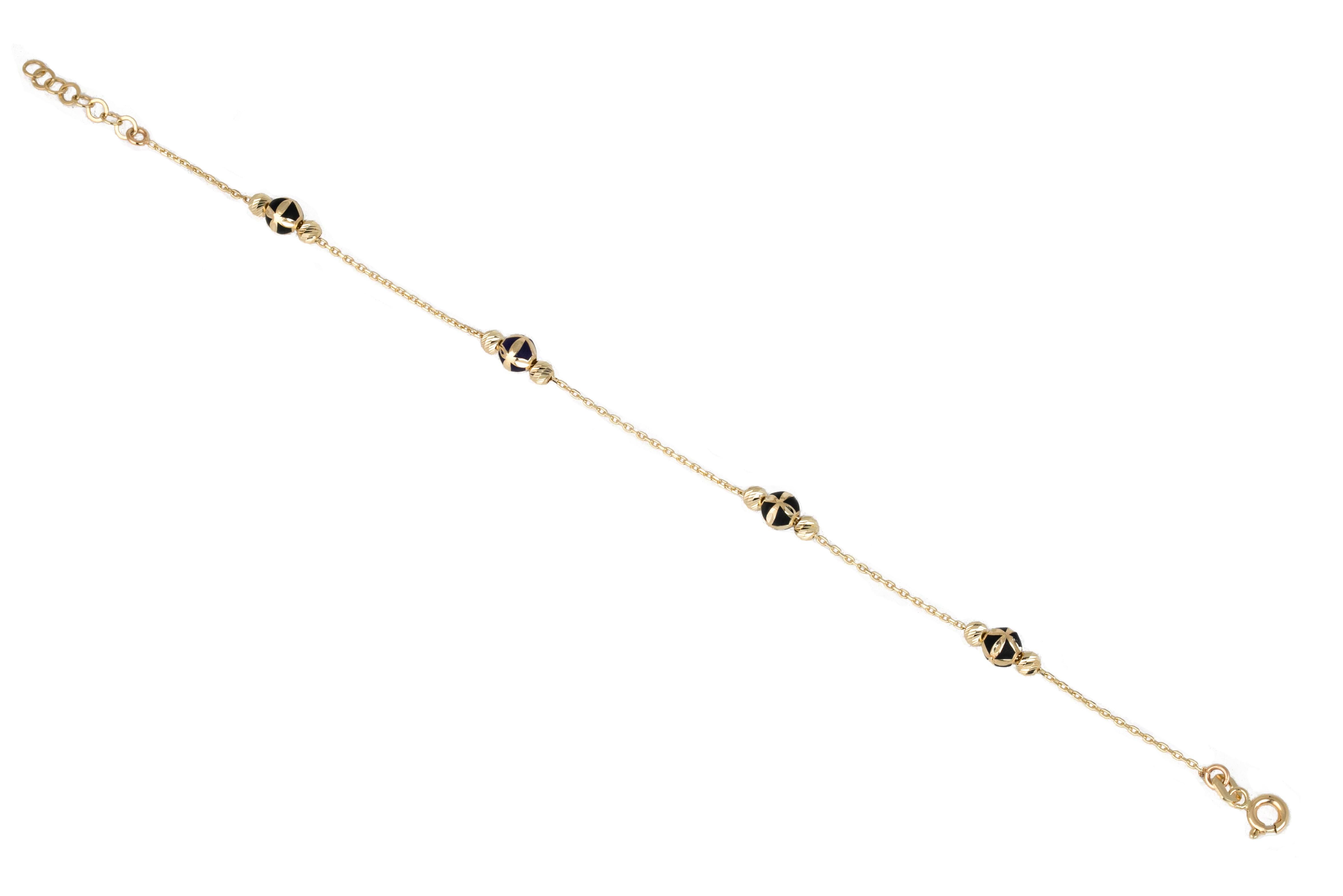14K Gold Bracelet Black Enameled and Dorica Collected Model Bracelet

Solid gold.
With hallmark.

Total Weight: 2,04 gr.
Size: 19.00 cm

*It is produced by placing two Dorica Balls on a forse chain and a large ball with Black Enamel and a pattern in