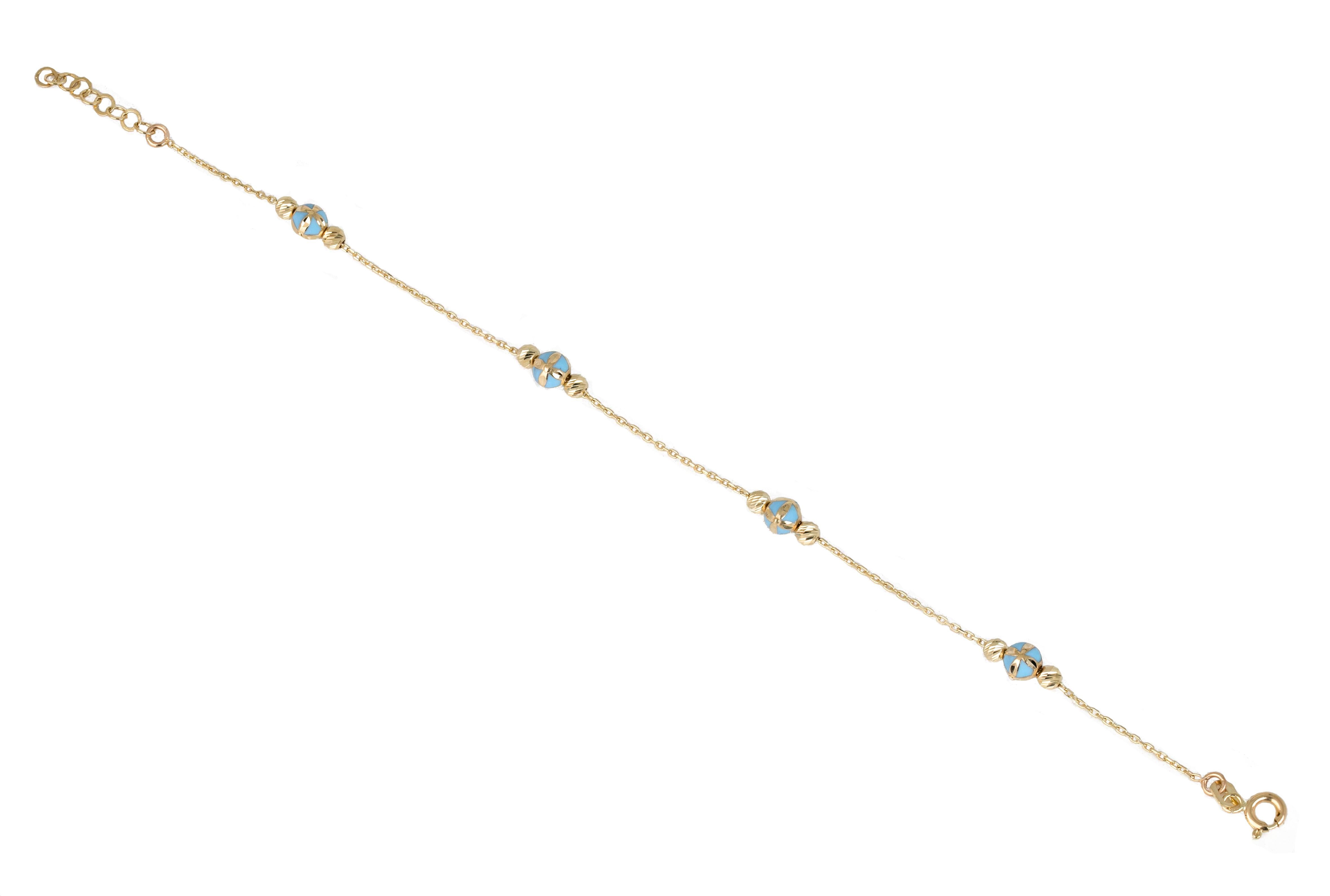 14K Gold Bracelet Blue Enameled and Dorica Collected Model Bracelet

Solid gold.
With hallmark.

Total Weight: 2,08 gr.
Size: 19.00 cm

*It is produced by placing two Dorica Balls on a forse chain and a large ball with Blue Enamel and a pattern in