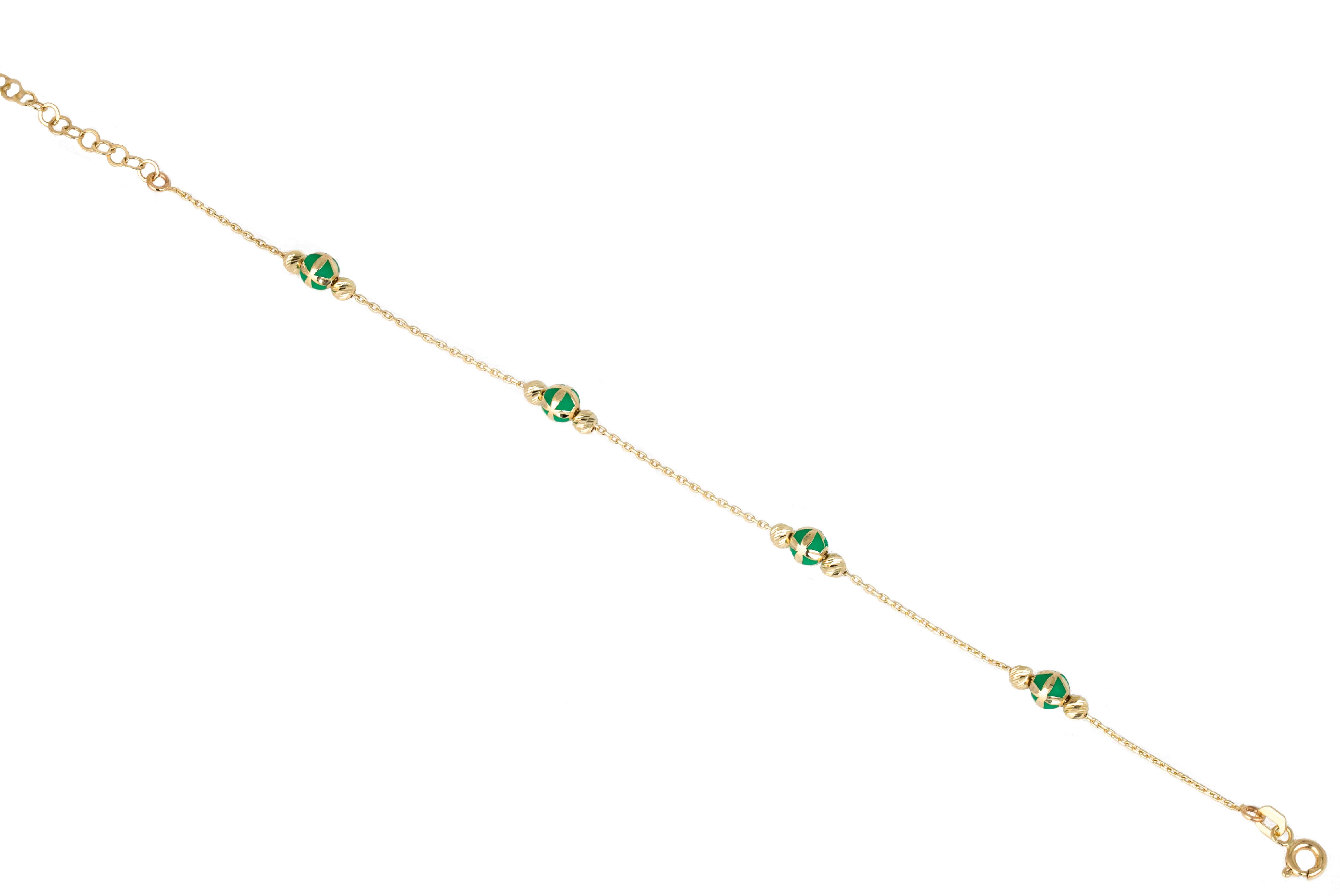 14K Gold Bracelet Green Enameled and Dorica Collected Model Bracelet

Solid gold.
With hallmark.

Total Weight: 2,11 gr.
Size: 19.00 cm

*It is produced by placing two Dorica Balls on a forse chain and a large ball with Green Enamel and a pattern in
