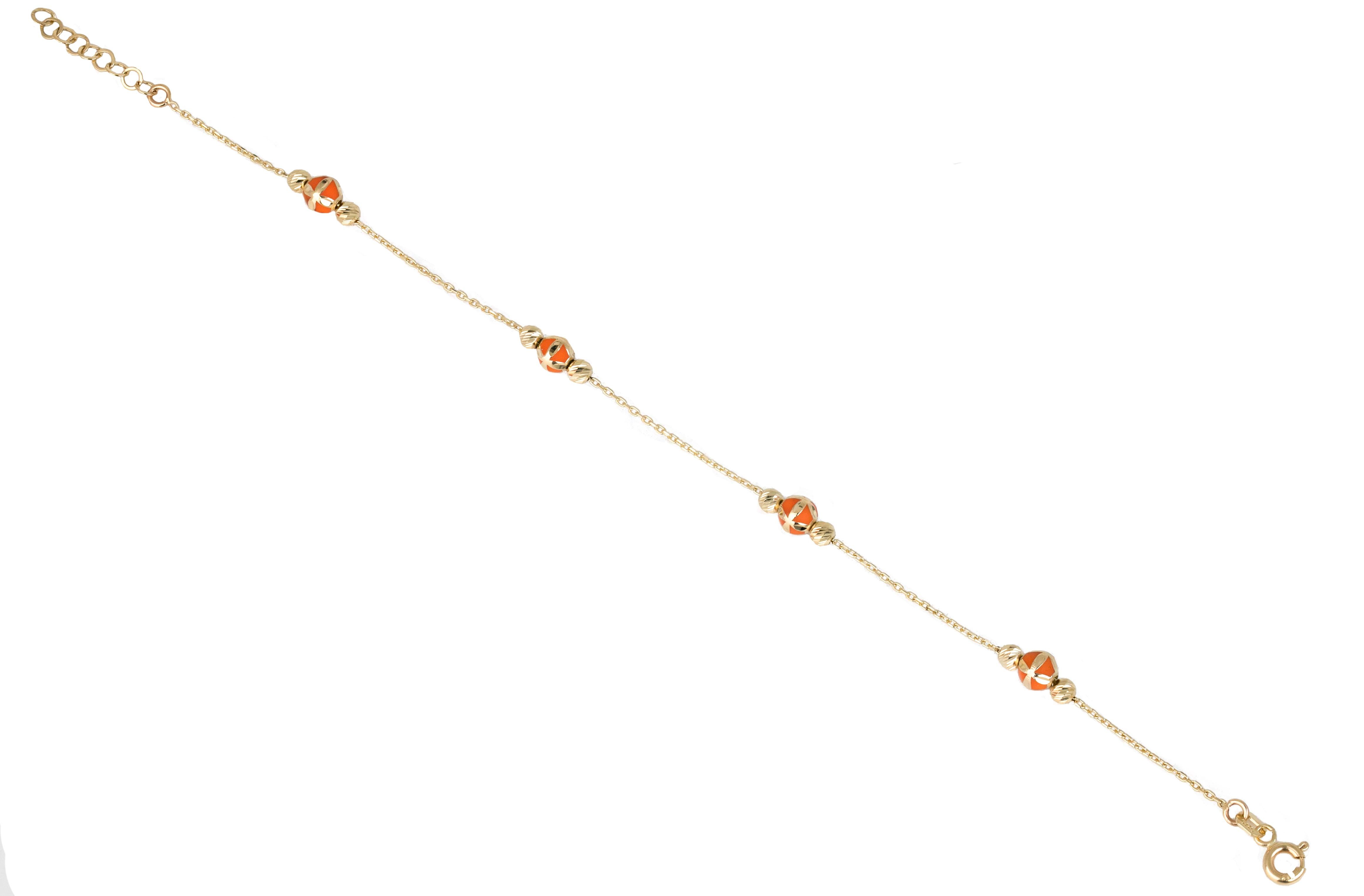 14K Gold Bracelet Orange Enameled and Dorica Collected Model Bracelet

Solid gold.
With hallmark.

Total Weight: 2,08 gr.
Size: 19.00 cm

*It is produced by placing two Dorica Balls on a forse chain and a large ball with Orange Enamel and a pattern