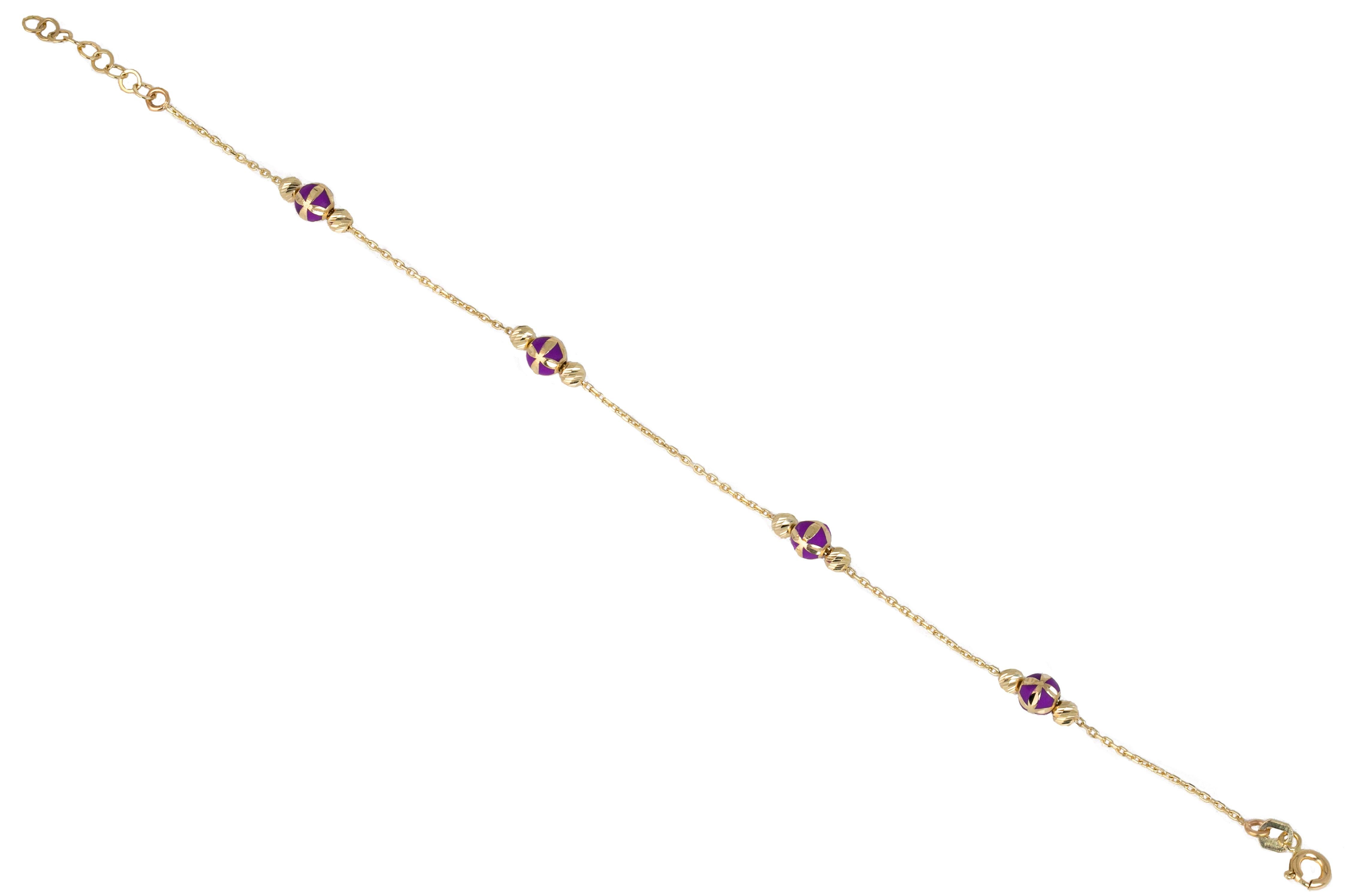 14K Gold Bracelet Purple Enameled and Dorica Collected Model Bracelet

Solid gold.
With hallmark.

Total Weight: 2,07 gr.
Size: 19.00 cm

*It is produced by placing two Dorica Balls on a forse chain and a large ball with Purple Enamel and a pattern