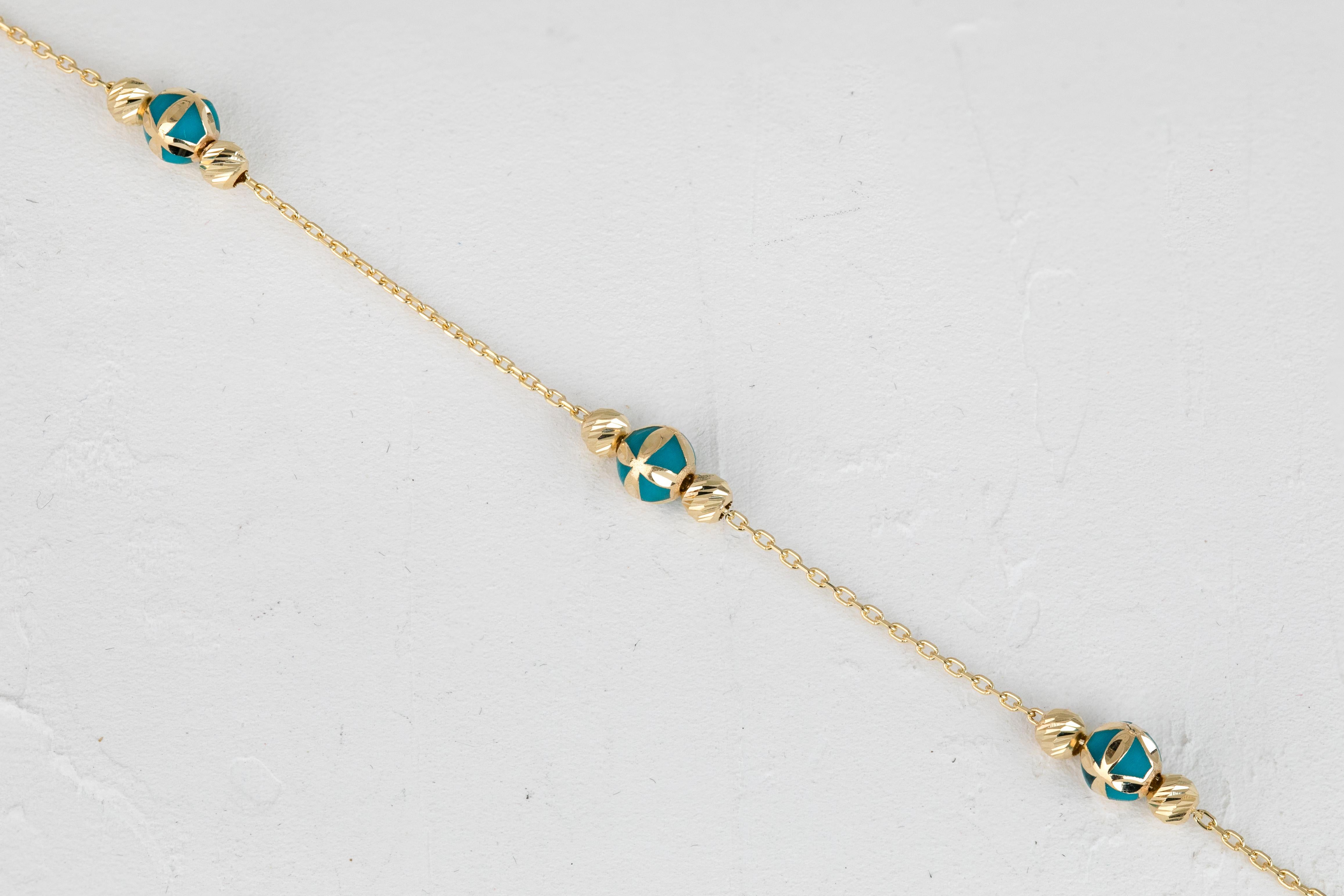 14K Gold Bracelet Turquoise Enamel and Dorica Collected Model Bracelet

Solid gold.
With hallmark.

Total Weight: 2,04 gr.
Size: 19.00 cm

*It is produced by putting two Dorika Balls on a forse chain and a large, modeled ball with Turquoise Enamel