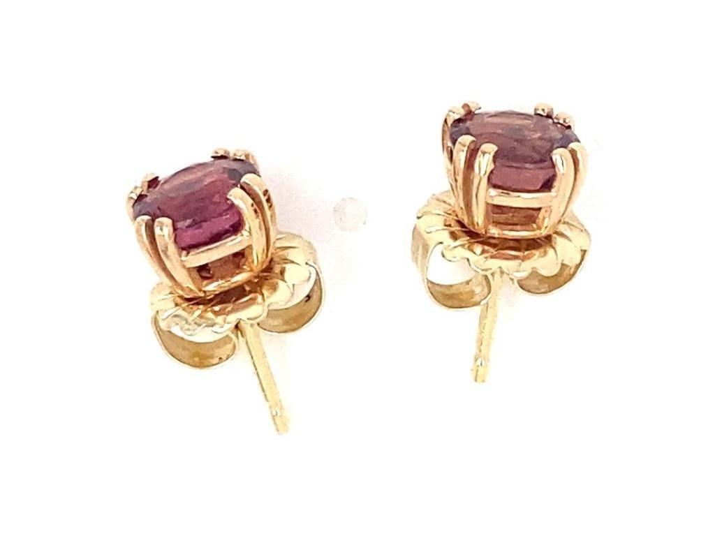 Earrings feature a single Pink Tourmaline stone measuring appx 7 x 7mm
Mounted in 14k Yellow Gold
Gross Weight: 3.10 grams
Overall Condition: Very Good. Signs of superficial wear on backside of earrings and screw on backs on the form of light