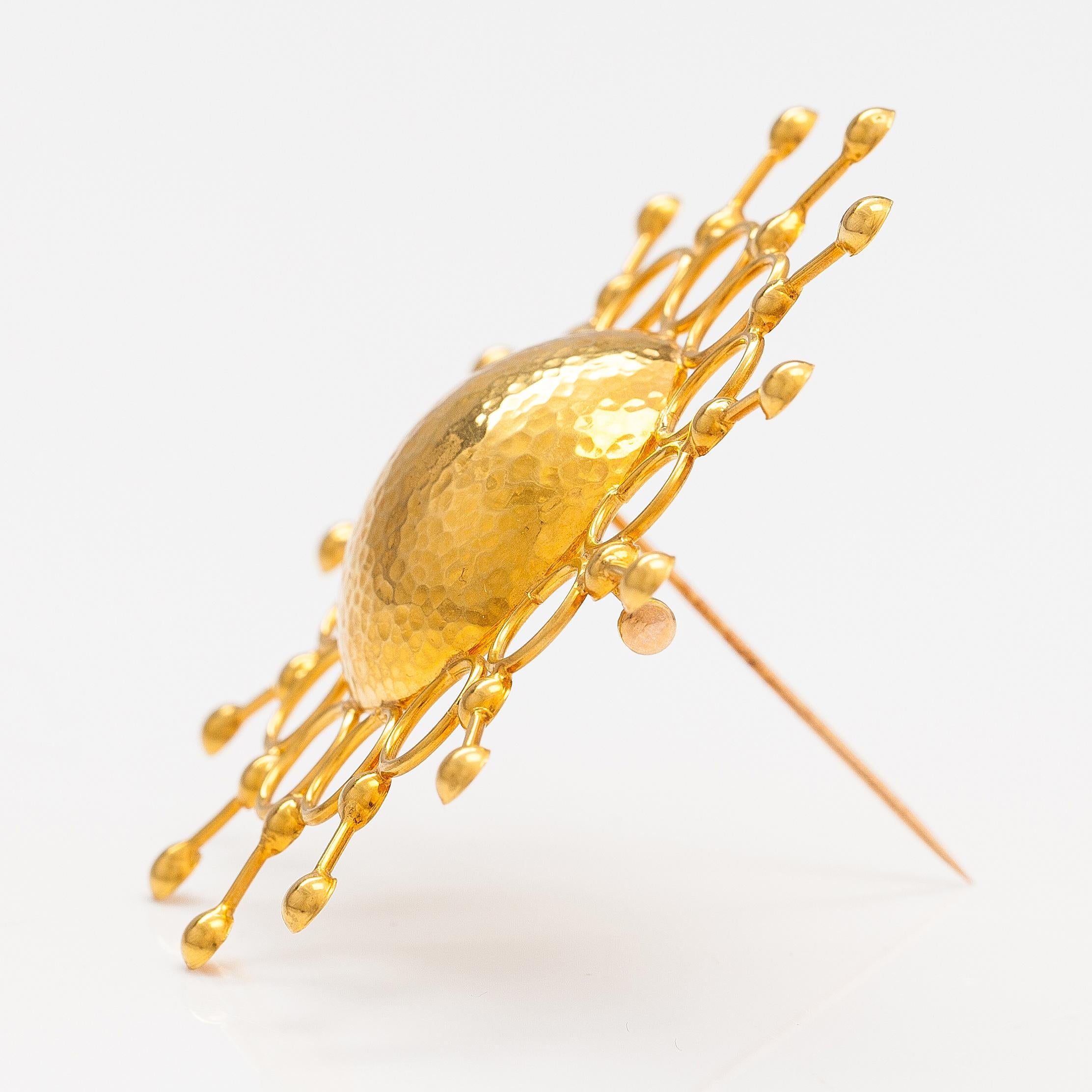 Gold brooch made by Nilo Westerback in 1970. Weight is 11.3g of 14k gold. 
Nilo Westerback is a jewelry store in Helsinki. This brooch was designed by someone but unfortunately the designer is unknown.