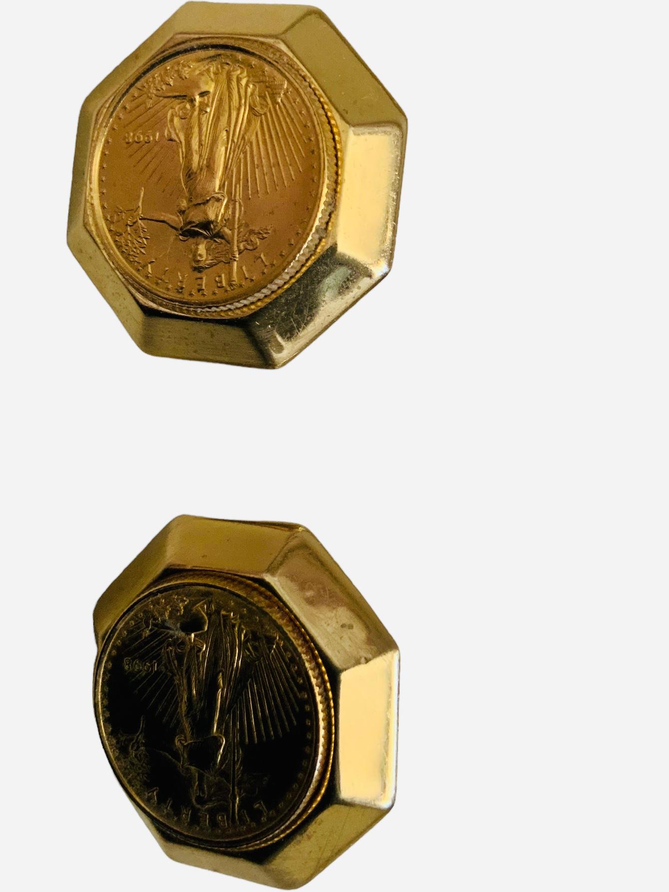 This is a Gold Buillon Coins set mounted in a ring, pair of earrings and pendant. The 14K gold octagonal design ring contains an original United States of America 1/10 oz fine gold, five dollars 1997 and its weight is 14.5 grams. Its size is 8.5.