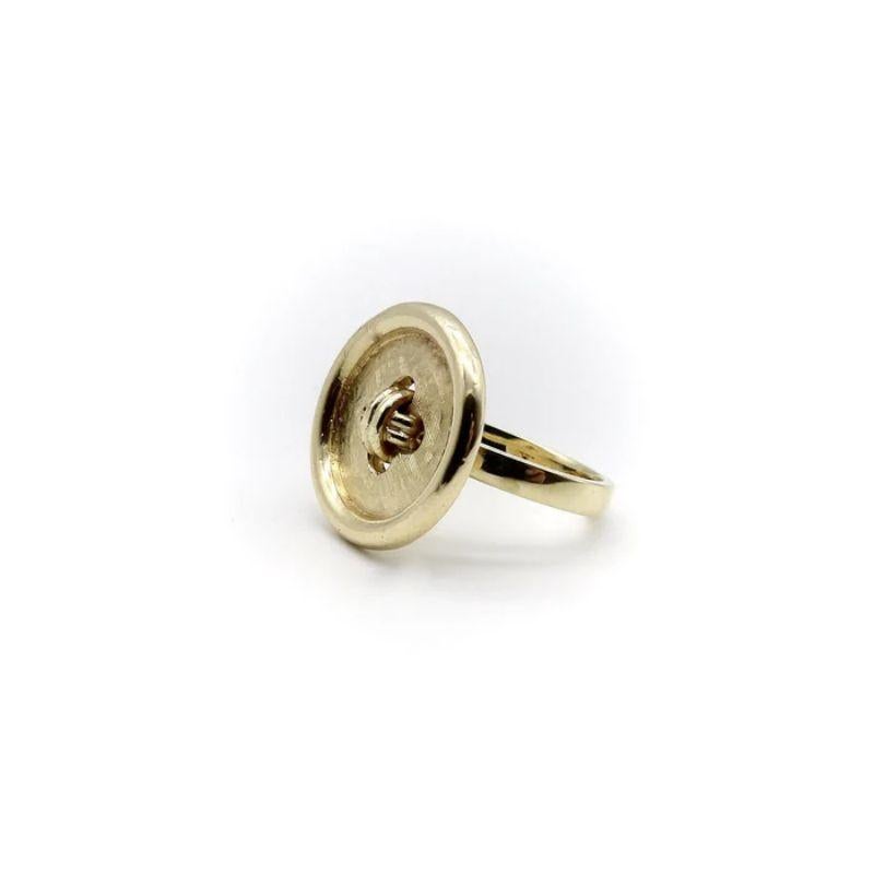 This 14k gold button ring looks like a button… because it was a button! This is a Kirsten’s Corner Signature Piece, made by adding a shank to a 14k gold vintage button so that it could be worn as a ring. The button has a cool three dimensional