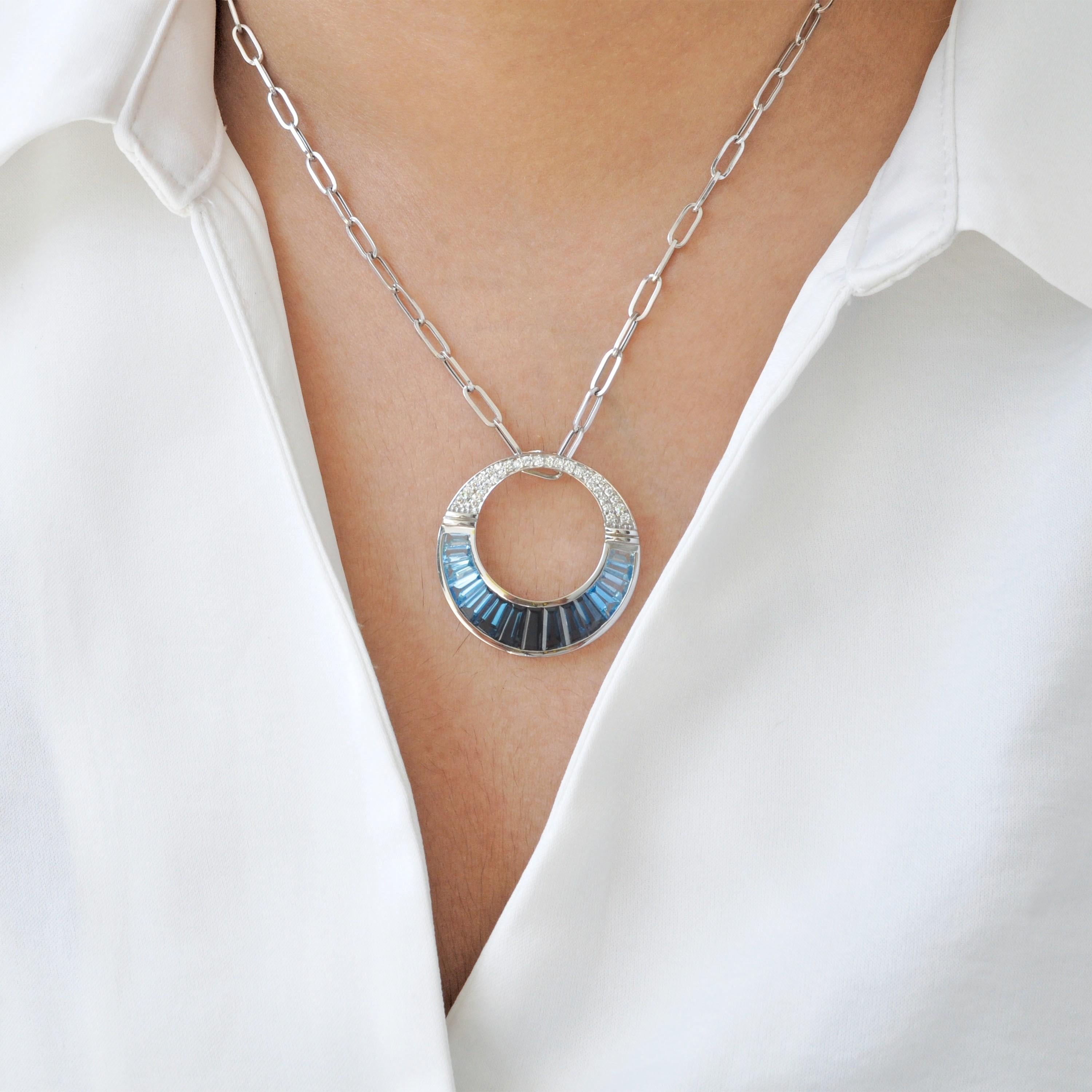 14 Karat Gold Calibre Cut Blue Topaz Baguette Diamond Pendant Necklace Brooch

Inspired by regal elegance of Cleopatra and reimagined with a modern twist, this 14K gold convertible pendant and brooch showcases the cool brilliance of 6.694 carats of