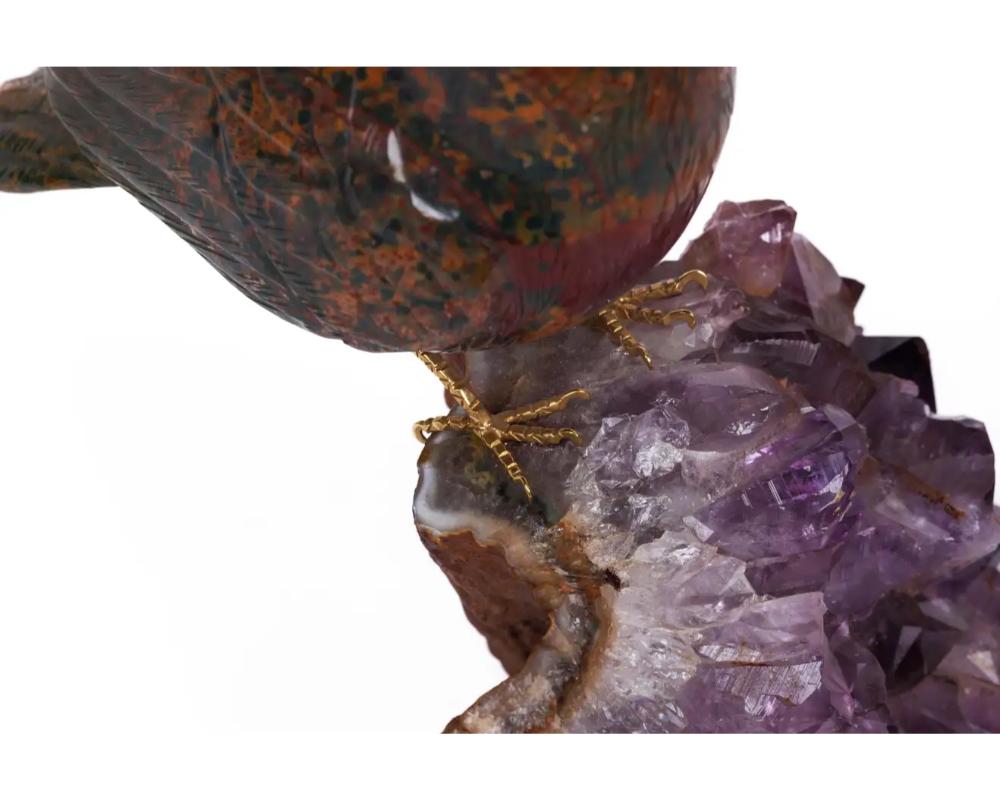 14K gold, carved jasper bird on an amethyst rock geode

Hand-carved jasper bird with diamond eyes and 14k gold feet, sitting on an amethyst geode.

A really nice and cool object - a true collectors piece. Part of a larger group of birds we are