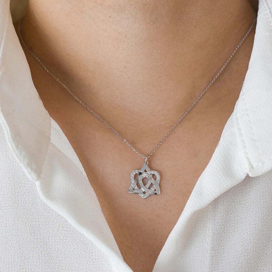 Beautiful Little Celtic Knot Pendant is made of 14k solid gold adorned with natural white round cut diamonds.
Available in three colors of gold: White Gold / Rose Gold / Yellow Gold. 

Perfect for wearing by itself for a minimal everyday style or