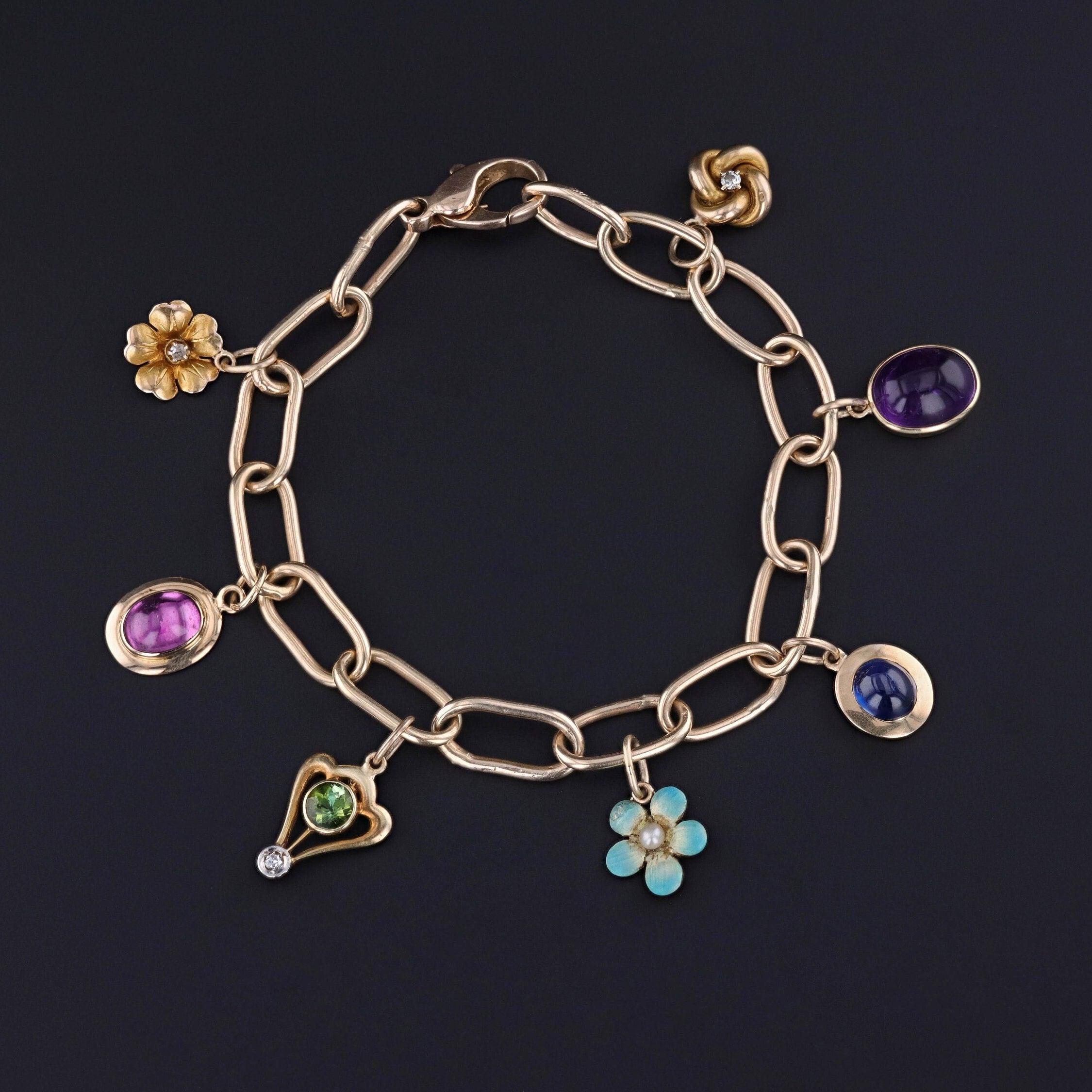 Taglio ovale Bracciale Charm in oro 14k con 7 Charme Antiques in vendita