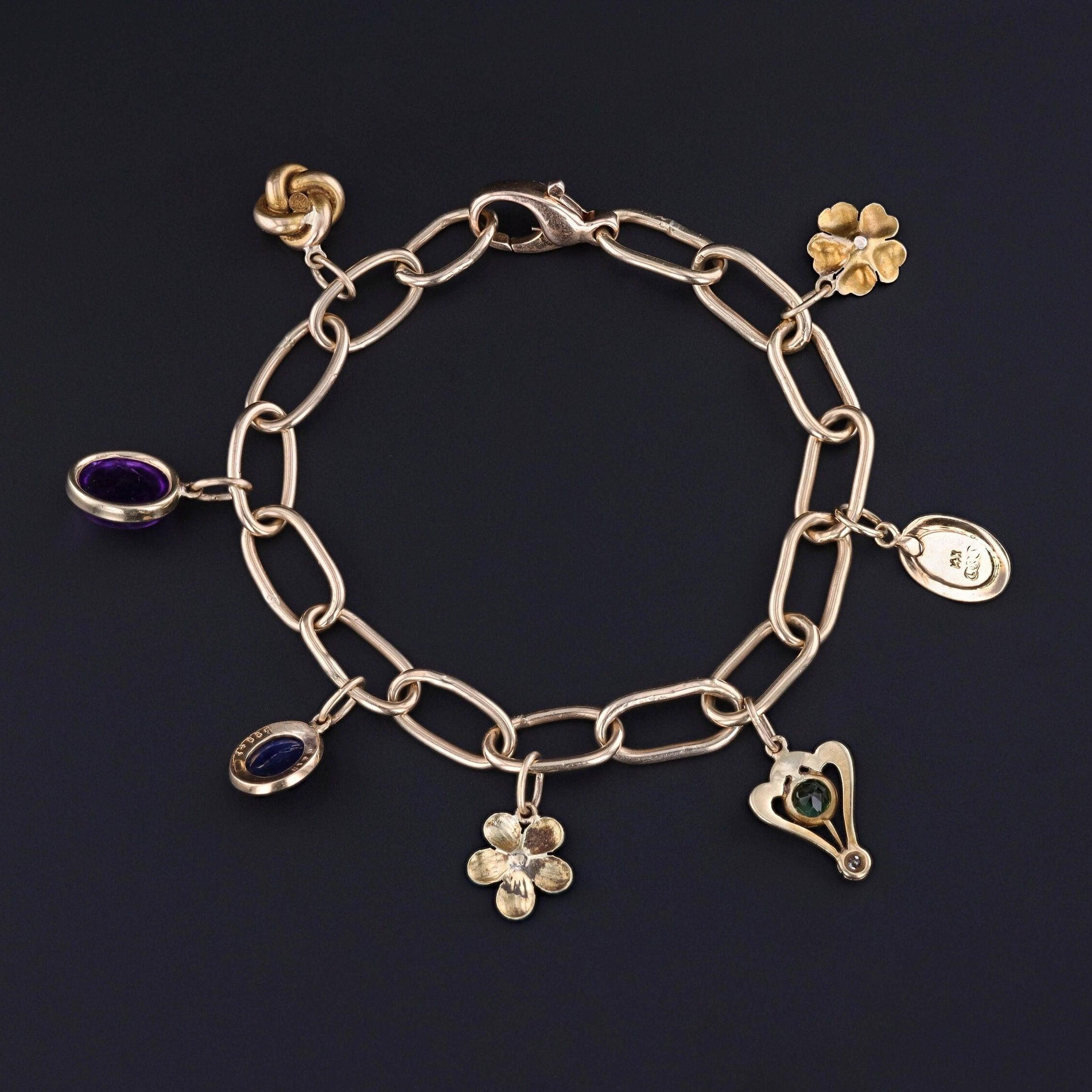 Bracciale Charm in oro 14k con 7 Charme Antiques In condizioni buone in vendita a Lewisburg, PA