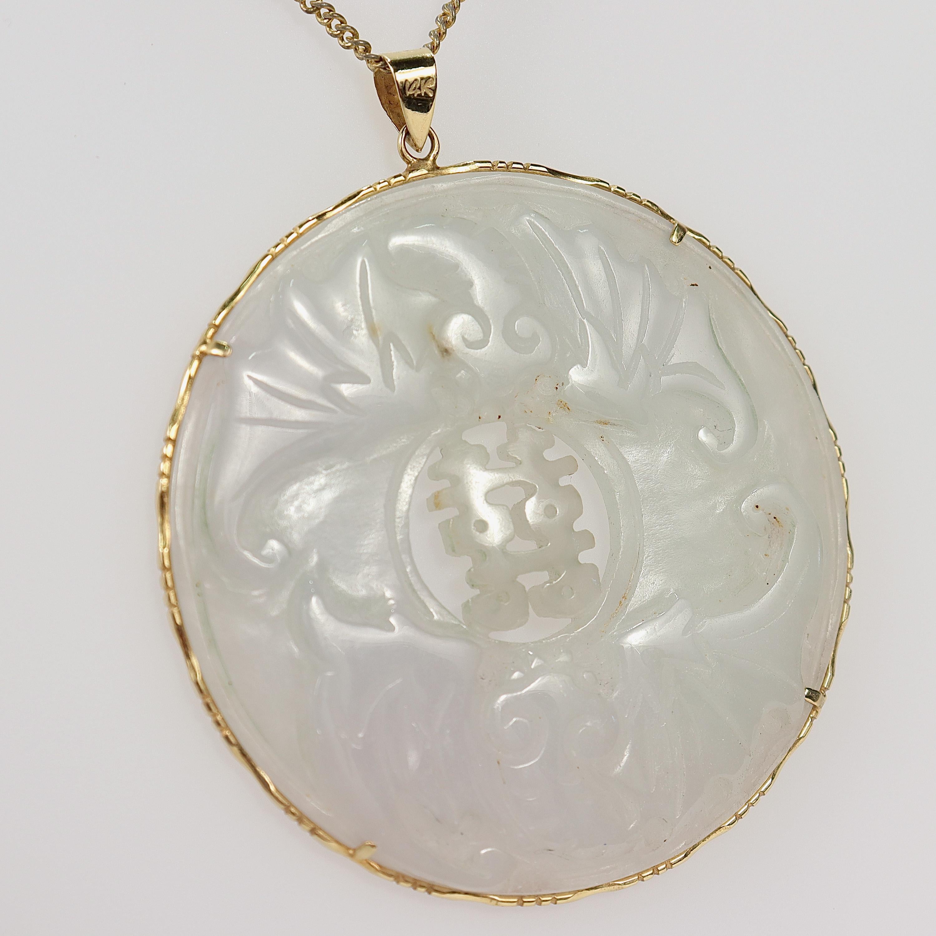 A fine Chinese gold & jade pendant.

With a large carved jade amulet prong set in a 14k gold frame. 

From a defunct 1970s jewelry shop. This pendant is from a group of old, unsold inventory that was rediscovered after 50 years.

Simply a wonderful