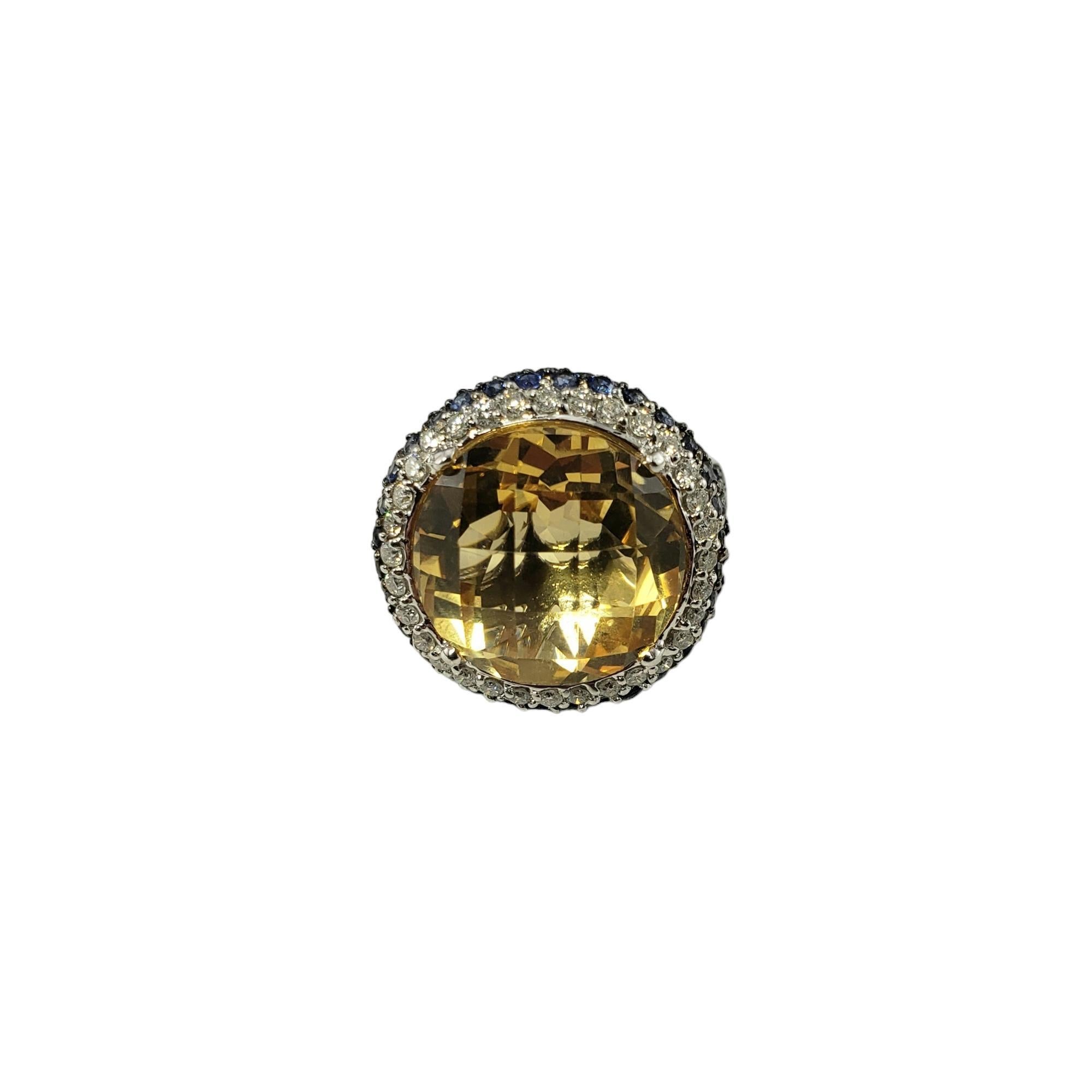 Vintage 14K White Gold Citrine, Diamond and Sapphire Ring Size 7.25 

This stunning ring features one round citrine quartz stone (14.6 mm x 14.6 mm), 142 round sapphires and 32 round brilliant cut diamonds set in beautifully detailed 14K white gold.