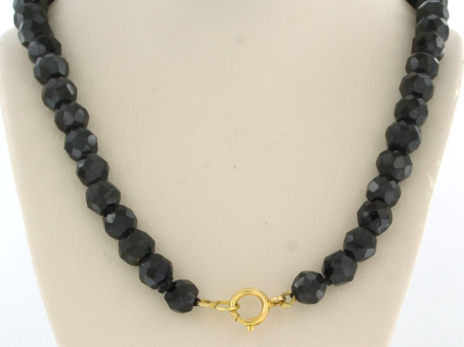 14k gold clasp and garnet bead necklace with gold center piece - 44 cm