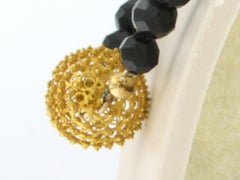 14k gold clasp on and garnet bead necklace with gold centerpiece - 44.3 grams