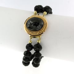 14-karätiger Goldverschluss mit Granat an einem doppelreihigen Granatarmband - 44,4 Gramm