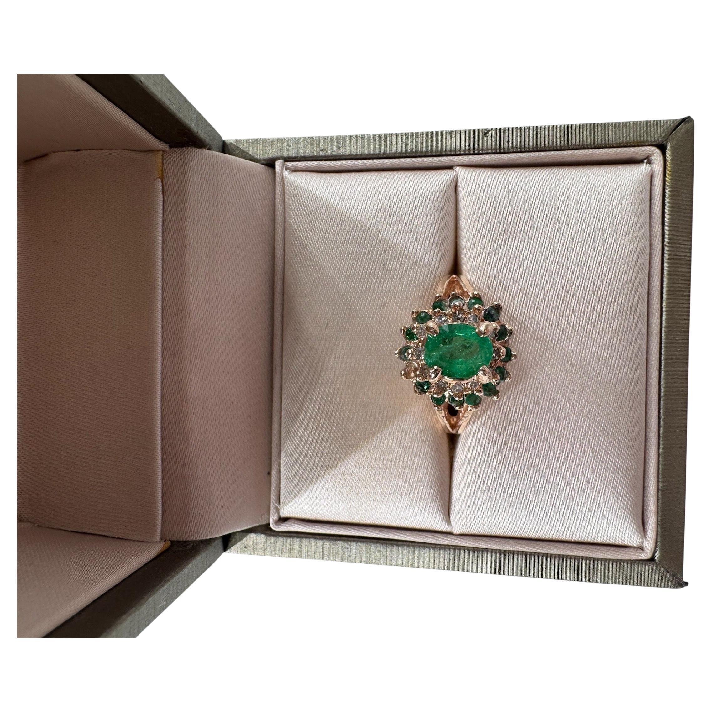 Elegant and timeless, this 14K gold ring showcases a rich cluster of natural emeralds totaling 1.60 carats, with a vivid central stone framed by additional emerald accents. Surrounding the emeralds are 0.30 carats of brilliant F VS1 diamonds,