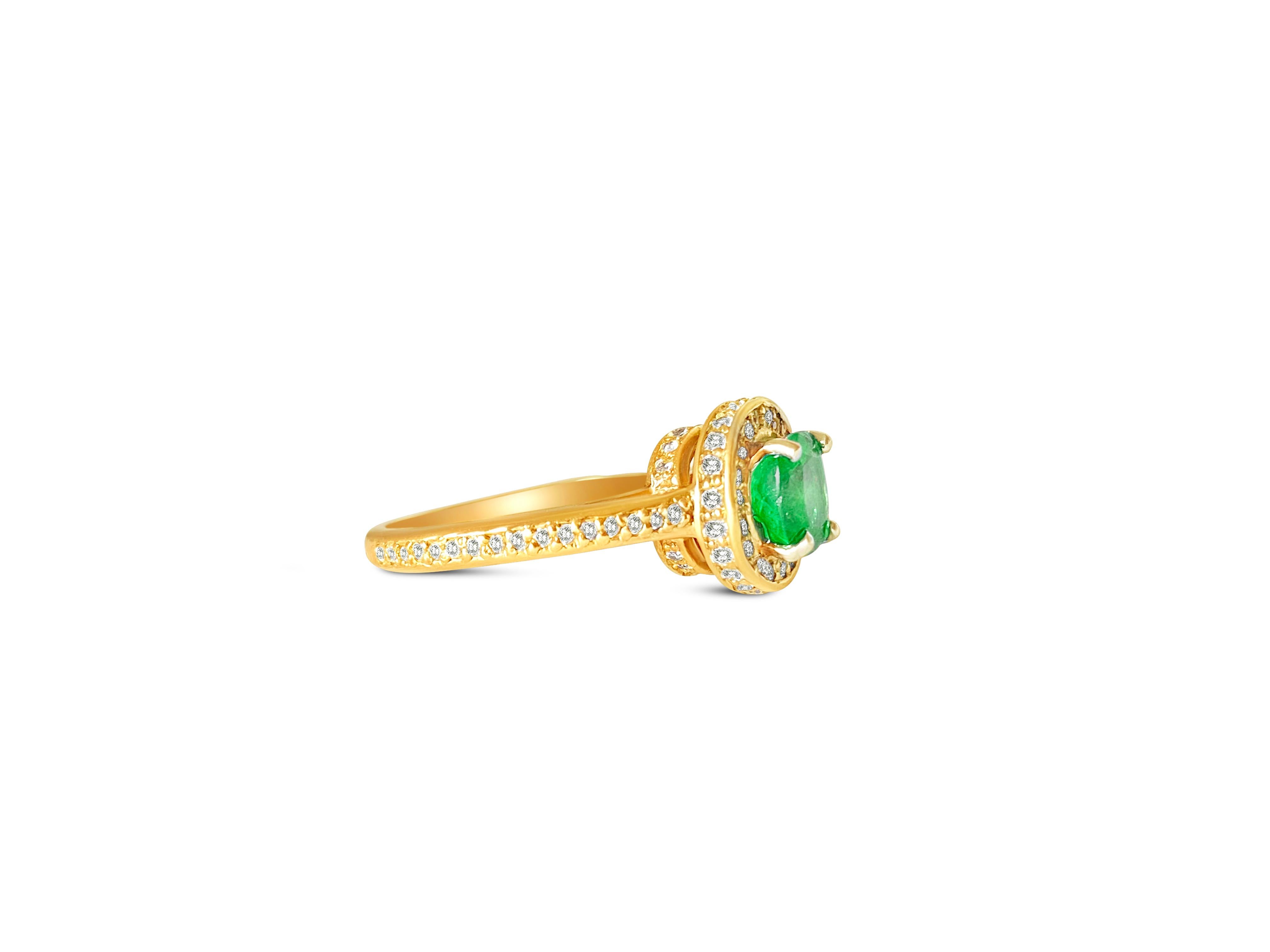 Indulge in elegant 14k rose gold, this engagement ring features a captivating 1.25 carat Colombian emerald at its center, set in a delicate prong setting. Surrounding the emerald are shimmering diamonds totaling 1.00 carats, exhibiting VS-SI clarity