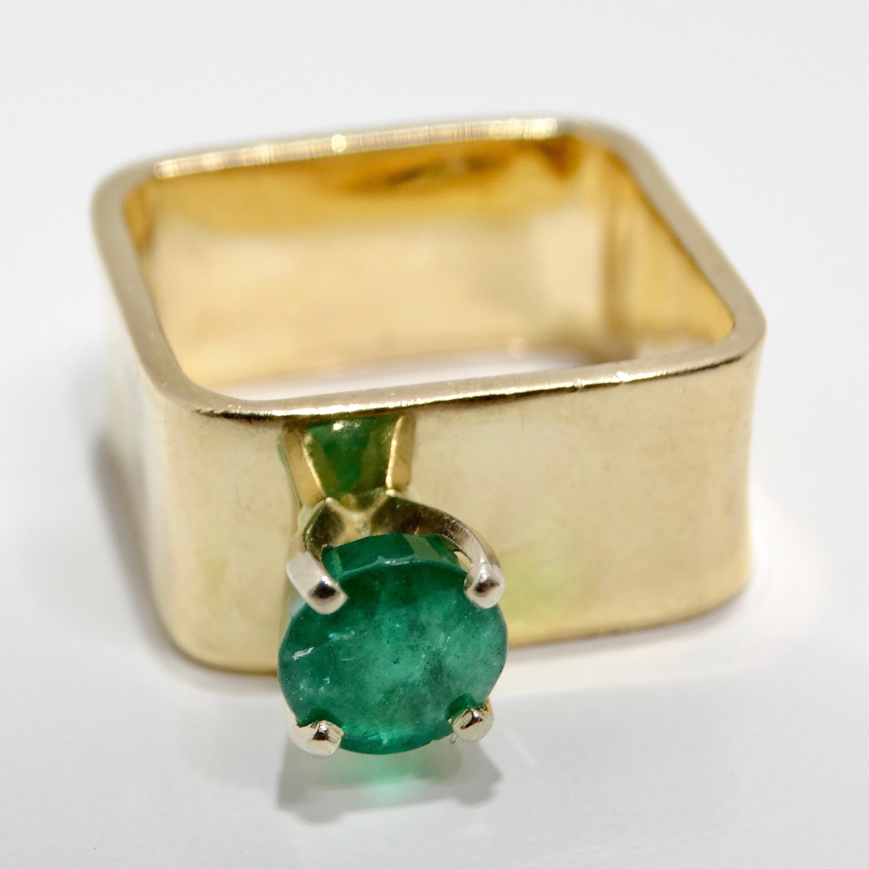 Introducing the breathtaking 14K Gold Colombian Emerald Square Cocktail Ring, a vintage masterpiece that exudes elegance and sophistication. Crafted in 1970, this stunning ring features a square-shaped Colombian emerald of deep, dark green hue,
