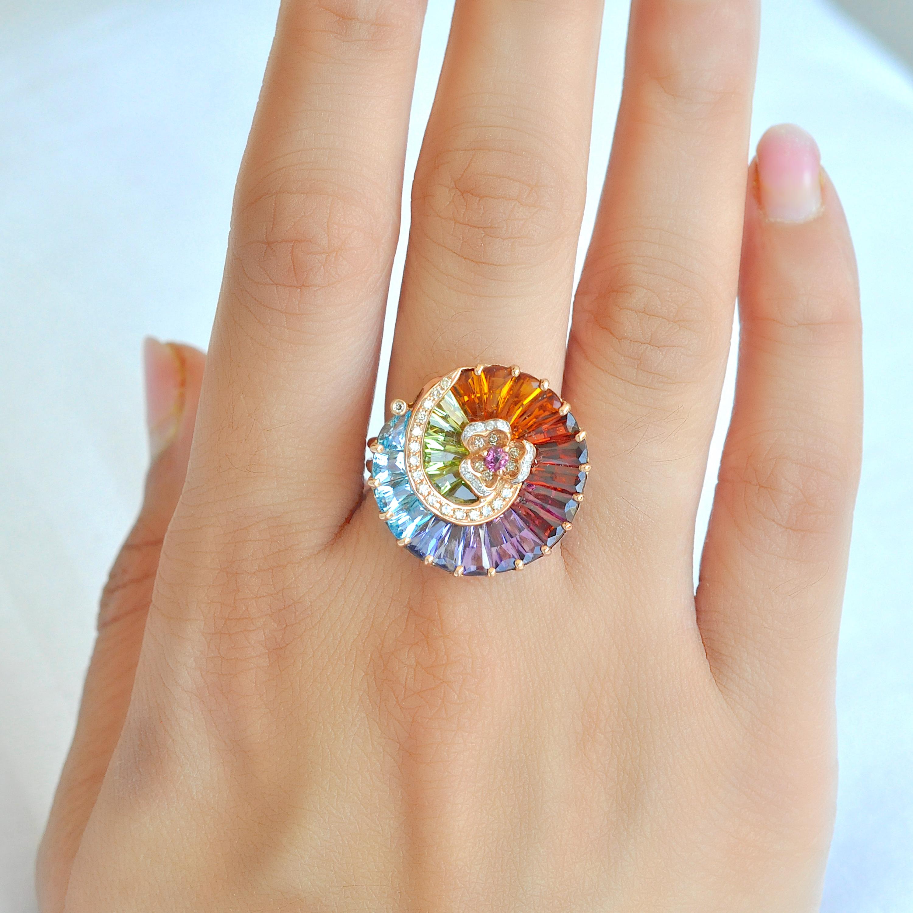 14K gold contemporary spiral rainbow multicolour gemstone diamond cocktail ring

This multicolored natural gemstone cocktail ring is a stunning and intricate piece of jewelry. Tapered cut gemstones like citrine, peridot, garnet, rhodolite, amethyst,