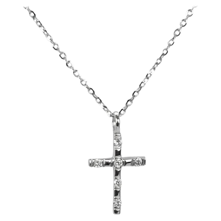 Diamond Cross Necklace is made of 14k solid gold available in three colors of gold, White Gold / Rose Gold / Yellow Gold.

6 round cut diamonds set the shape of the simple and elegant design pendant. The diamonds are very high quality and have a