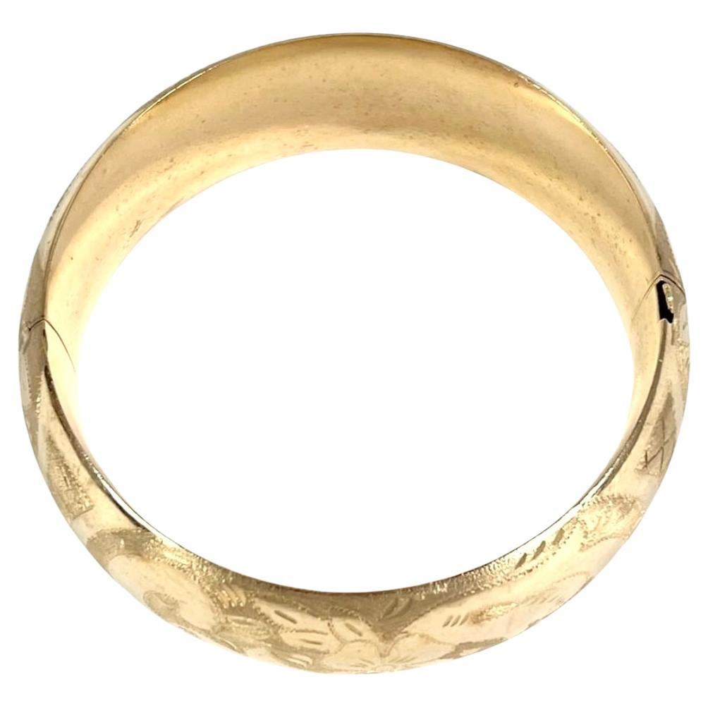  14K Gold Cuff Bracelet. Bracelet features a wide and elegant design with finely hand-etched floral and geometric patterns. This is a beautiful example of fine goldwork. With a substantial weight of 37 grams total weight, this piece has an