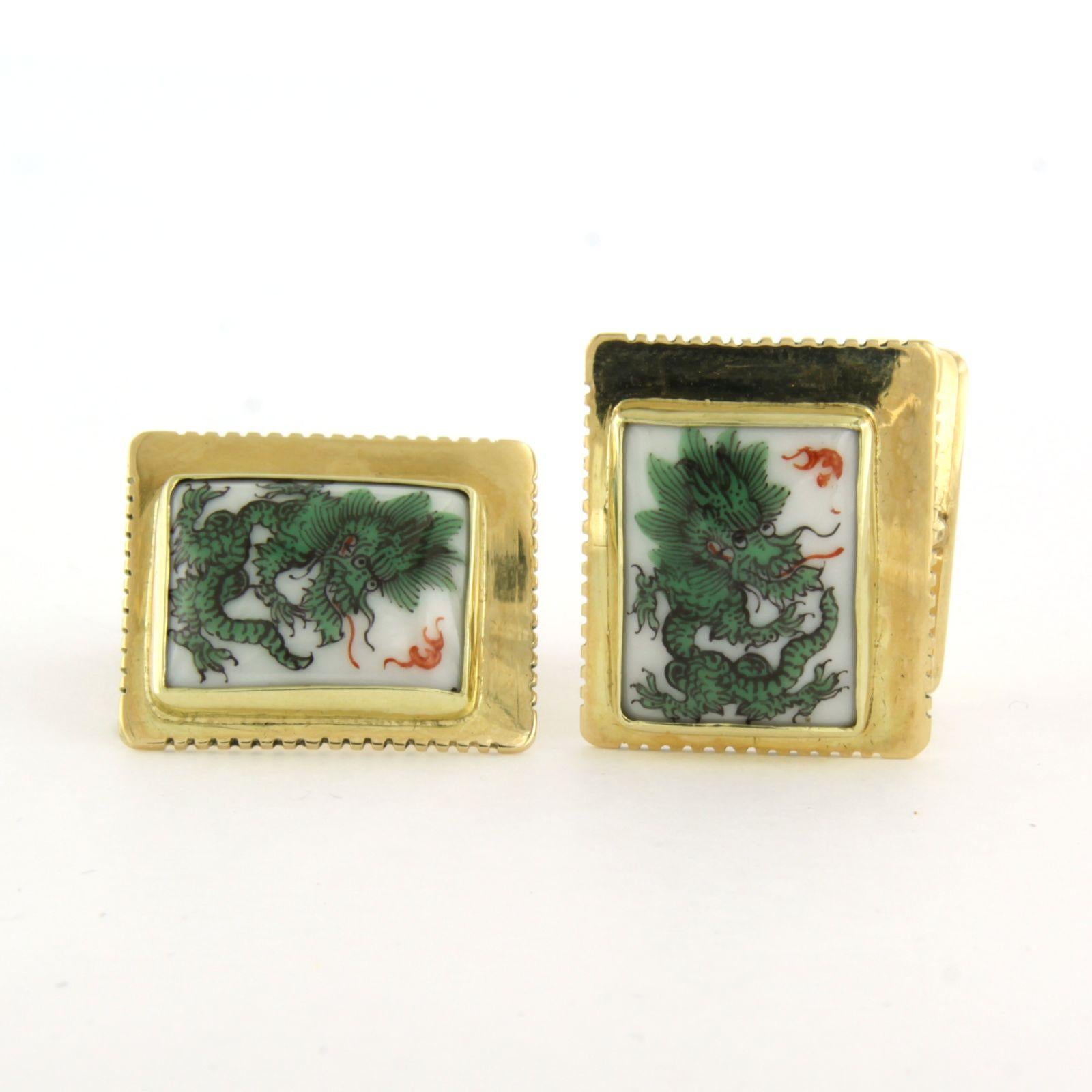 14k yellow gold cufflinks with square porcelain with print of a green dragon

detailed description:

the top of the button is in a rectangle of 2.1 cm by 1.8 cm wide

weight 14.9 grams

set with

- 2 x 1.6 cm x 1.3 cm rectangle shape
