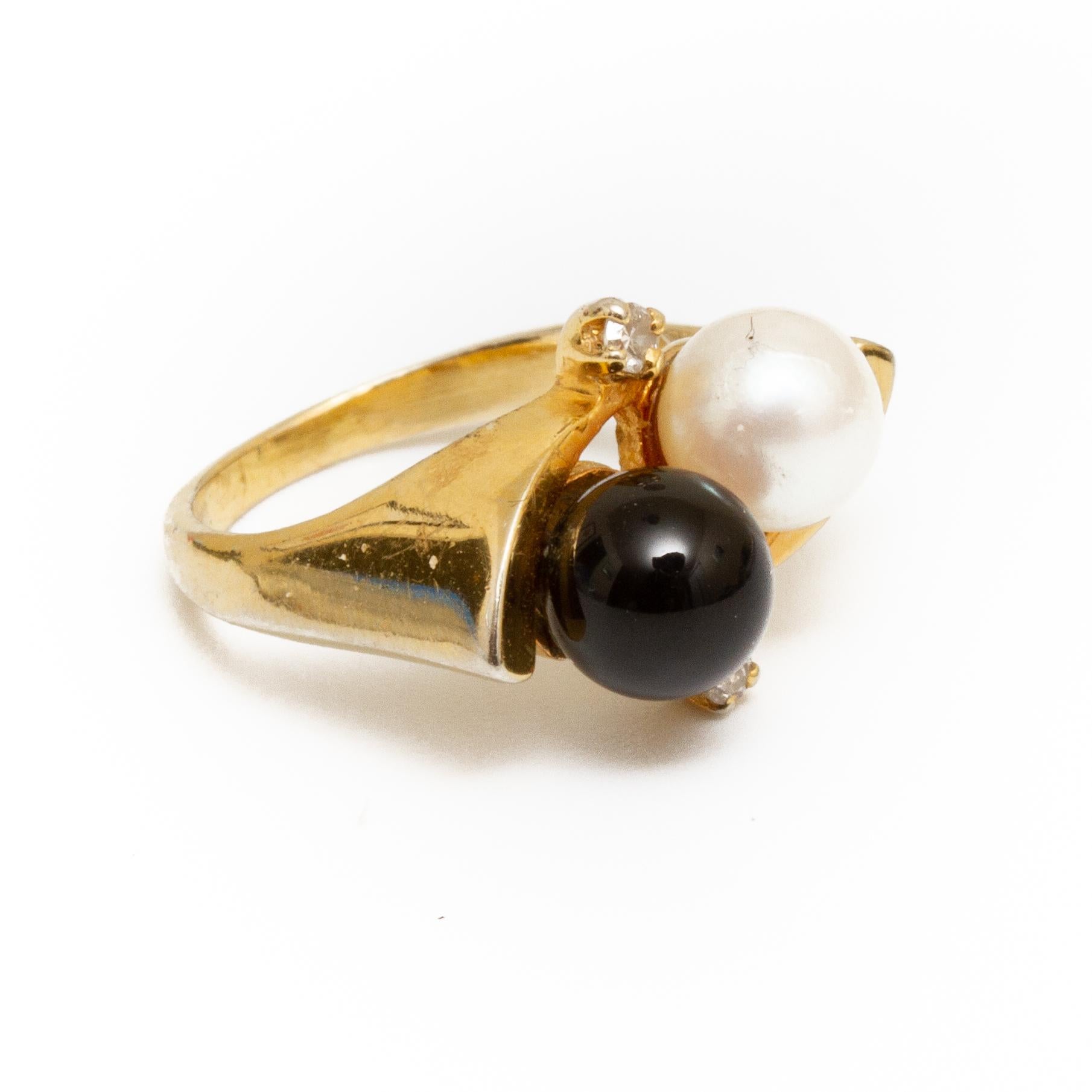 14k gold ring with black onyx and pearl and two small diamonds size approx 4.5 From the Broussard estate noted jewelry collection Park Avenue New York