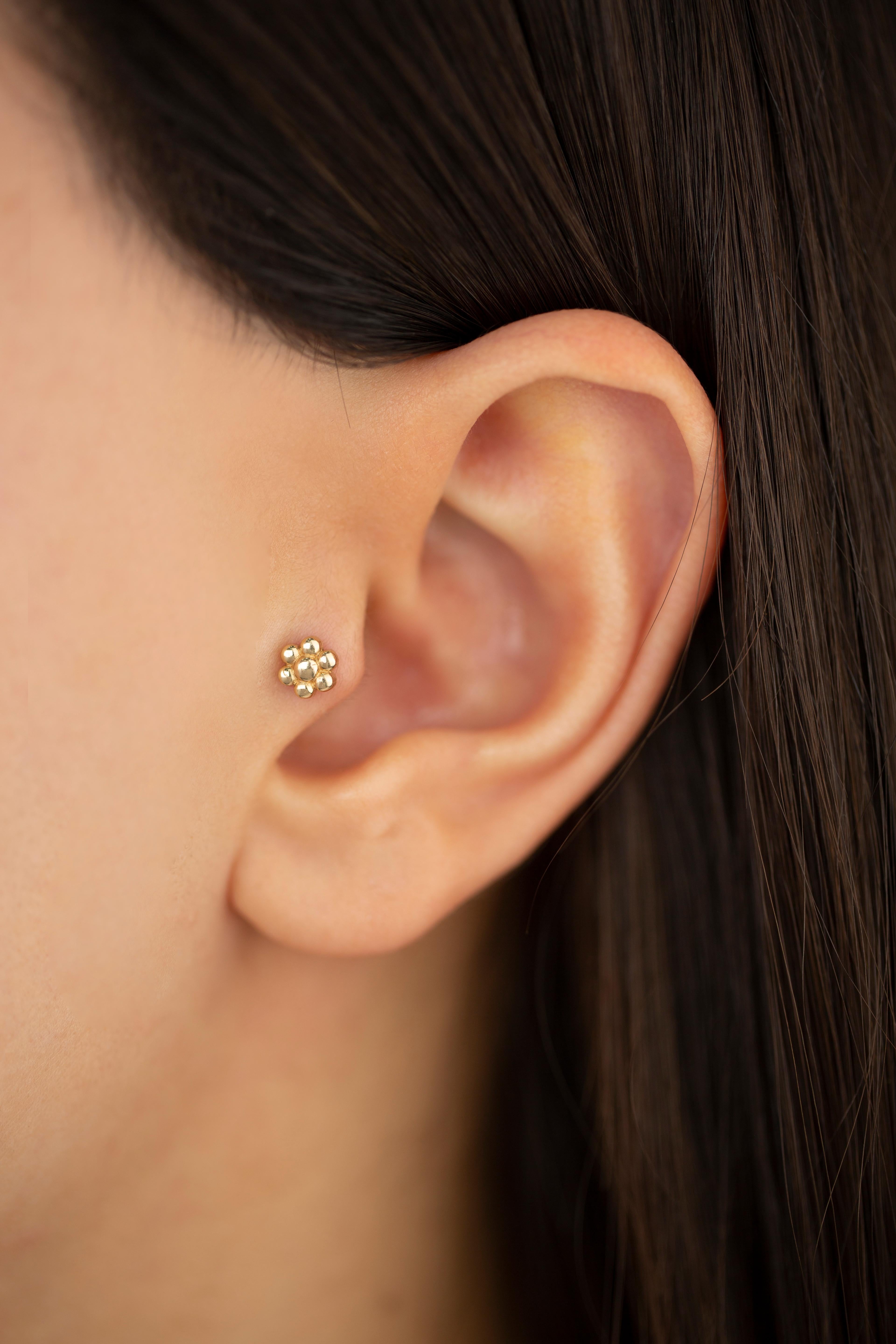 14K Gold Daisy Flower Piercing, Gold Stud Earring

You can use the piercing as an earring too! Also this piercing is suitable for tragus, nose, helix, lobe, flat, medusa, monreo, labret and stud.

This piercing was made with quality materials and