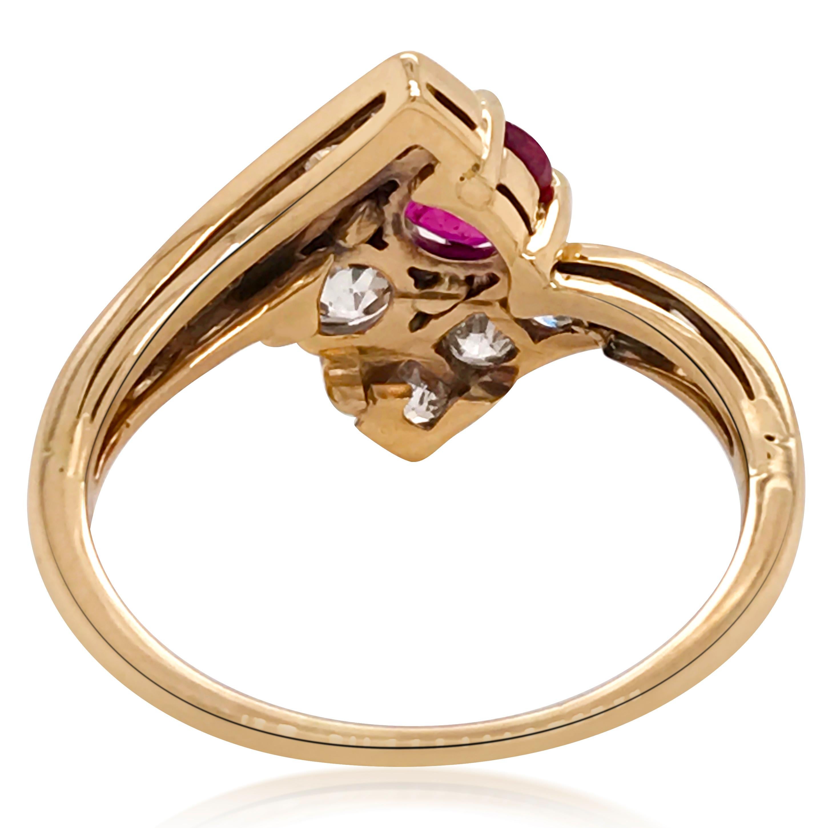 This shimmering ruby and diamond ring is crafted in 14K yellow gold, weighing 3.4 grams and in ring size 8 (adjustable). It is centered with one 0.57-carat round ruby and one 0.5-carat round diamond, further enhanced with two rows of diamonds,
