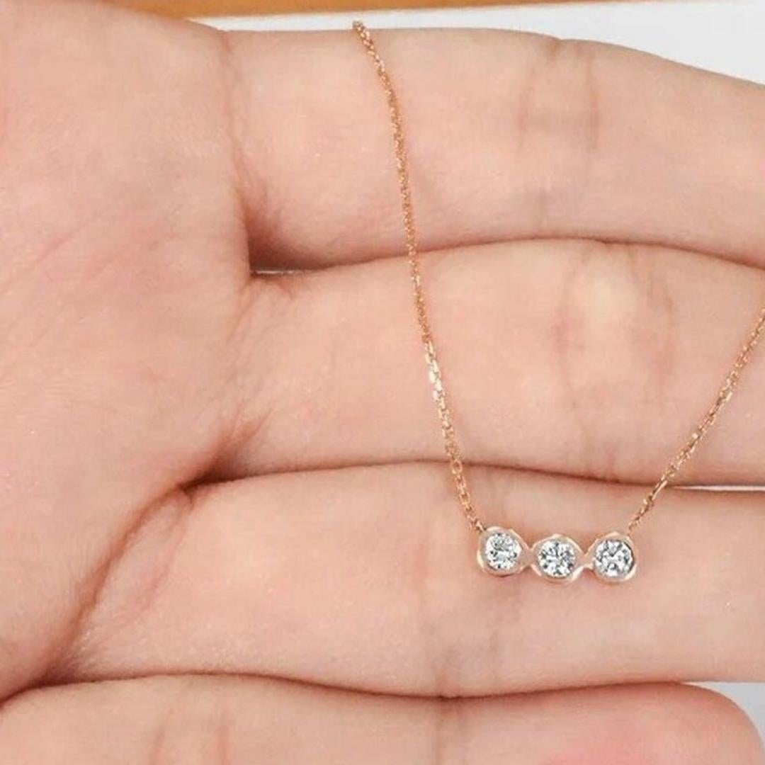 Bezel Set Diamond Necklace is made of 14k solid gold available in three colors of gold, White Gold / Rose Gold / Yellow Gold.

Three striking brilliant round cut diamond arranged horizontally row in a dainty gold chain. Each diamond is hand select