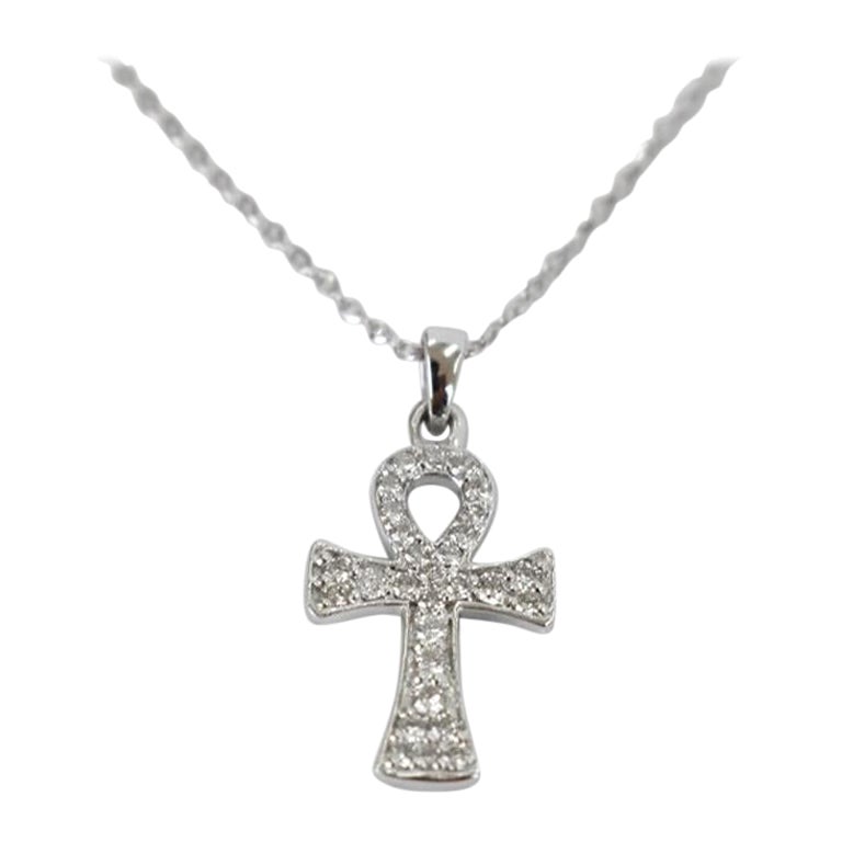 Diamond Cross Necklace is made of 14k solid gold available in three colors of gold, White Gold / Rose Gold / Yellow Gold.

31 round cut diamonds set the shape of the simple and elegant design pendant. The diamonds are very high quality and have a