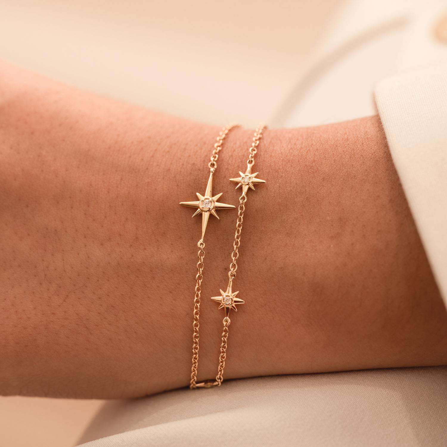 Our fine North Star range is a new collection of 14k Gold and Diamond guiding stars inspired by our ever-popular 'True North' Talisman designs.

This delicate 14k yellow gold bracelet features five diamond set Stars. Suspended on fine gold chain,