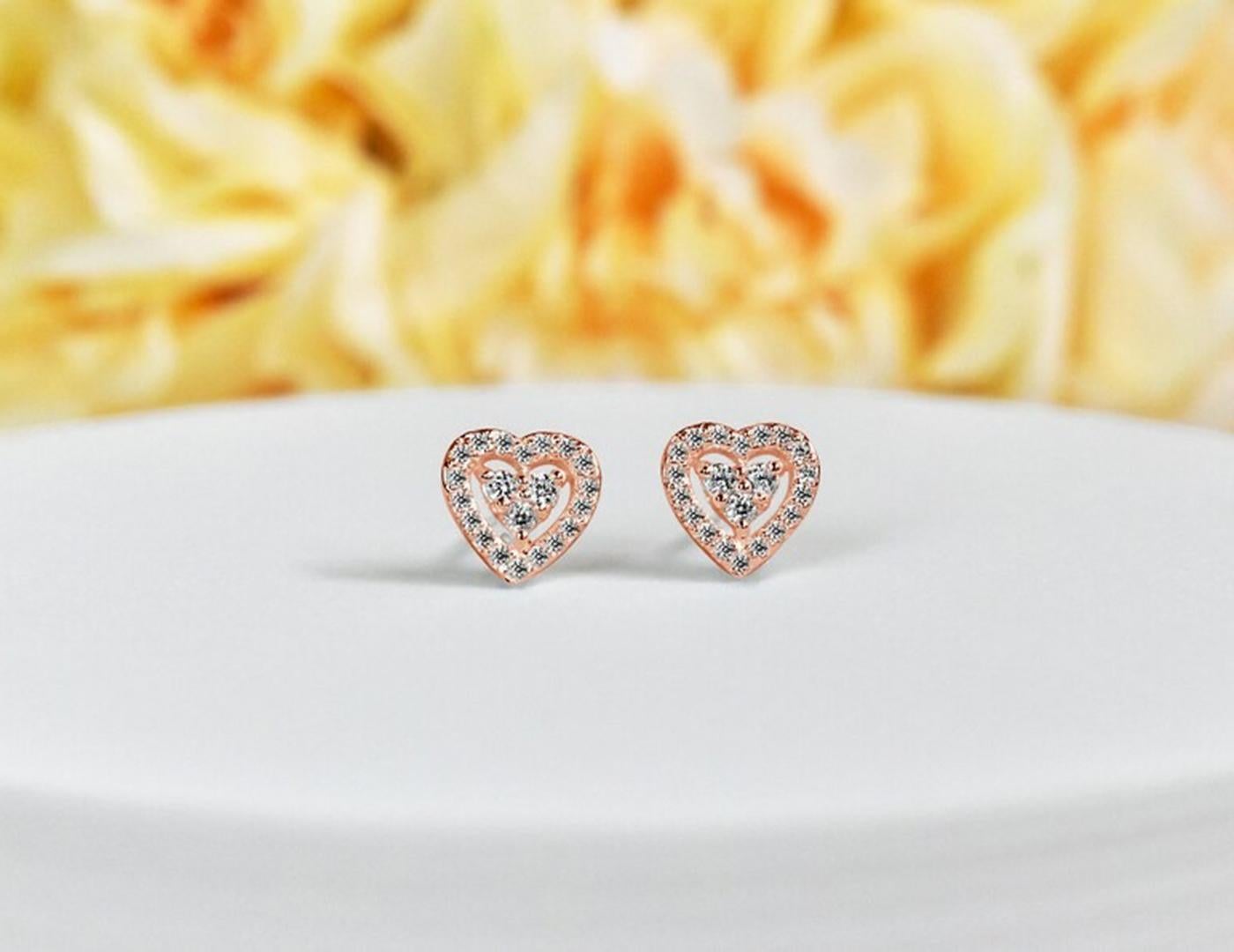 Diamond Heart Stud Earrings in 14k Rose Gold, Yellow Gold, White Gold.

These Dainty Stud Earrings are made of solid 14k gold featuring shiny brilliant round cut natural diamonds set by master setter in our studio. Simple but unique, elegant and