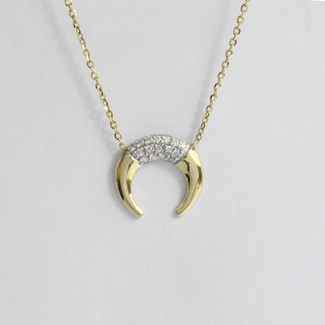 gold horn necklace meaning