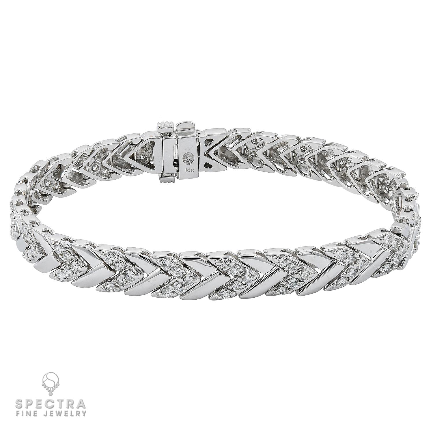 A line bracelet made with diamonds and in 14k white gold.
100 diamonds weighing a total of 5 carats, most with G-H color, VS-SI clarity.
Approximately 0.05 carat each.
7 inches long.
Gross weight 22.15 gram.