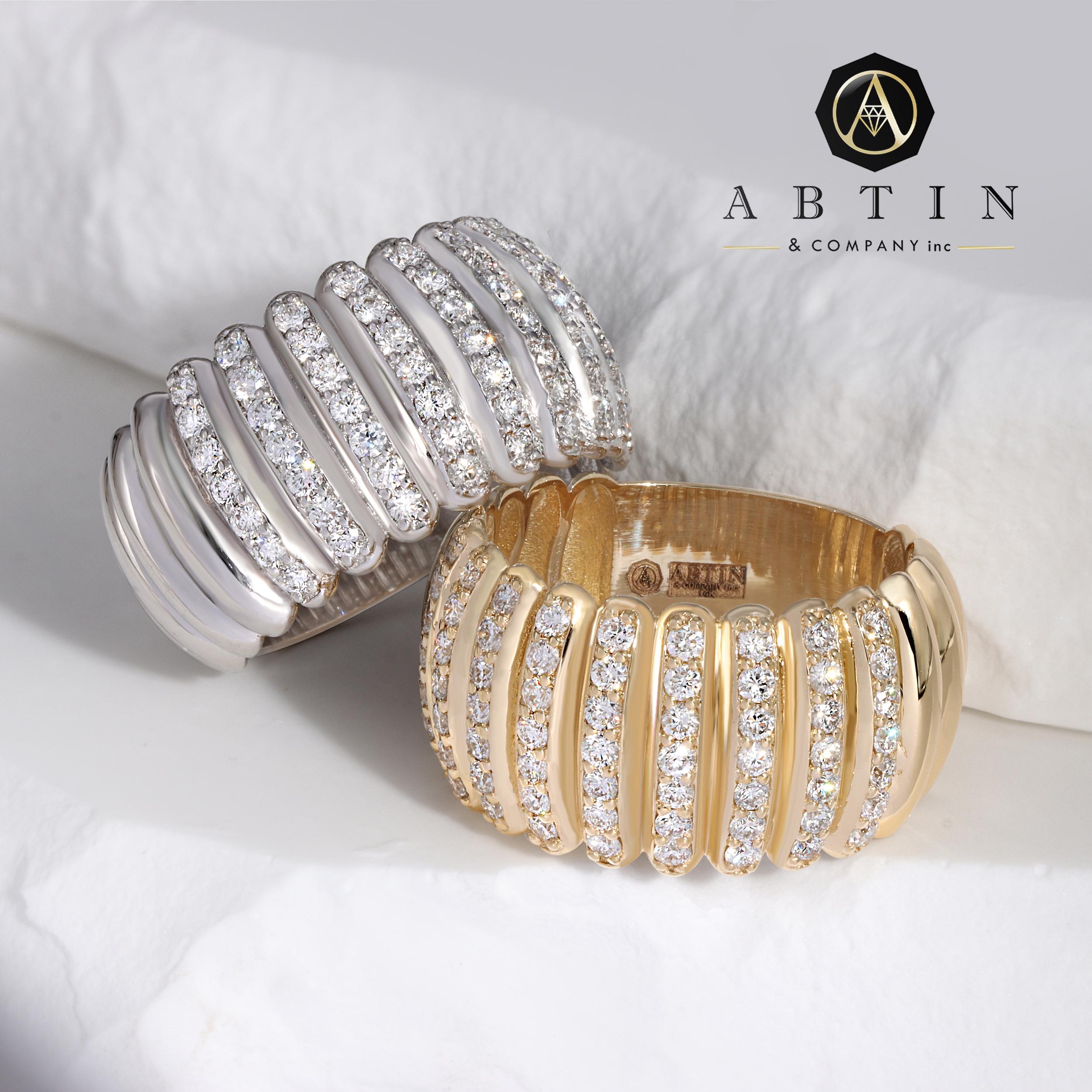 Crafted in 14K gold, this delightful line dome ring showcases 0.91 carats of round diamonds, in a tasteful classic look. This ring is easy and comfortable to slip on and off and a durable staple piece for modern women. Whether you were it solo or in