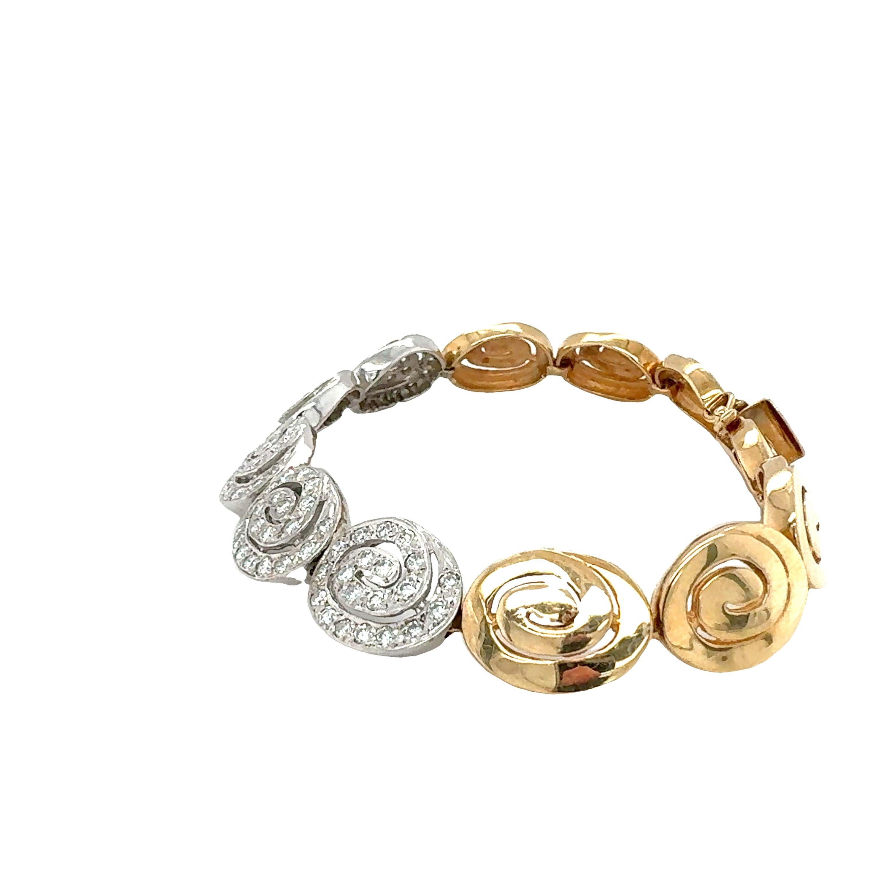 One 14K yellow and white gold diamond set oval swirl motif link bracelet with 100 bead set, round brilliant cut diamonds weighing 1.54 ct. in total with G-H color and VS-2 clarity. Matches with NO.EB.4.

Metal: 14K Yellow and White Gold
Gemstone: