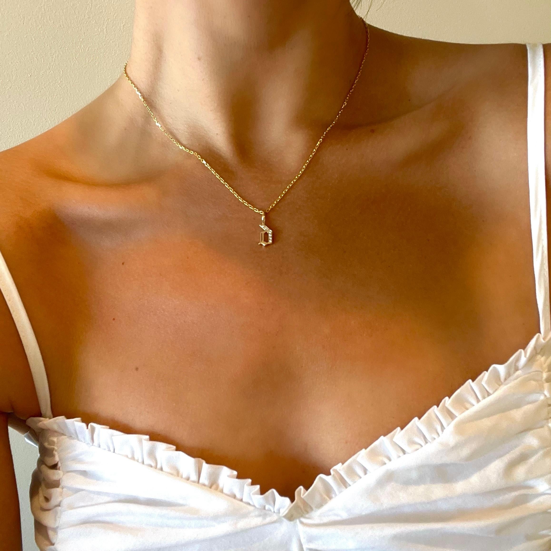 LIMITED TIME SUMMER SALE

Exquisitely constructed from solid 14k yellow gold, this timeless cable chain is elevated by our signature hand-pavé double-sided diamond clasp and gothic style diamond “r” pendant—a true statement of edgy elegance.