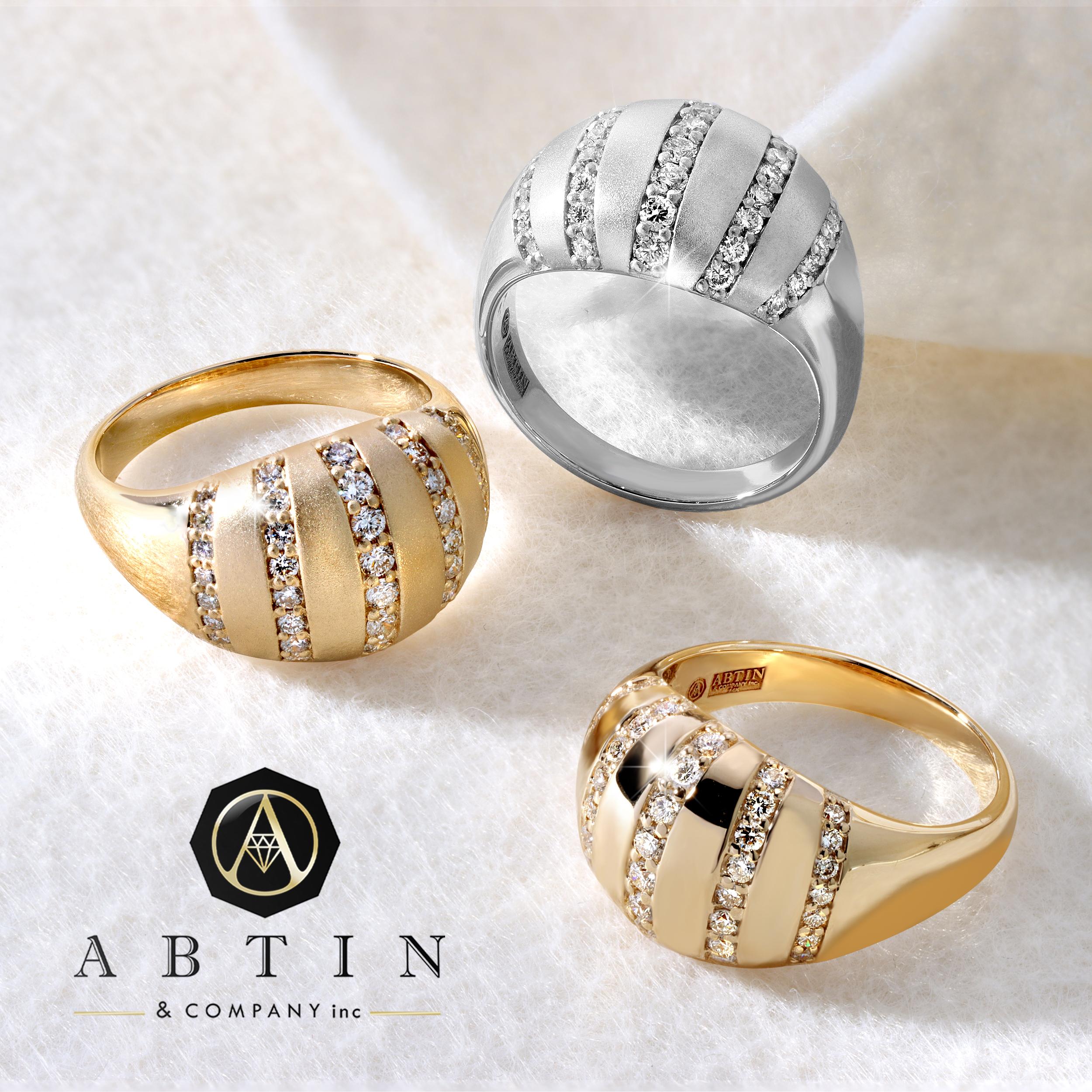 Crafted in 14K gold, this contemporary ring features stripe diamond studs softly rounding the golden surface in perfectly set rows of pave diamonds. The details on this ring is intricate and effortless. A must have for fashion forward modern women.