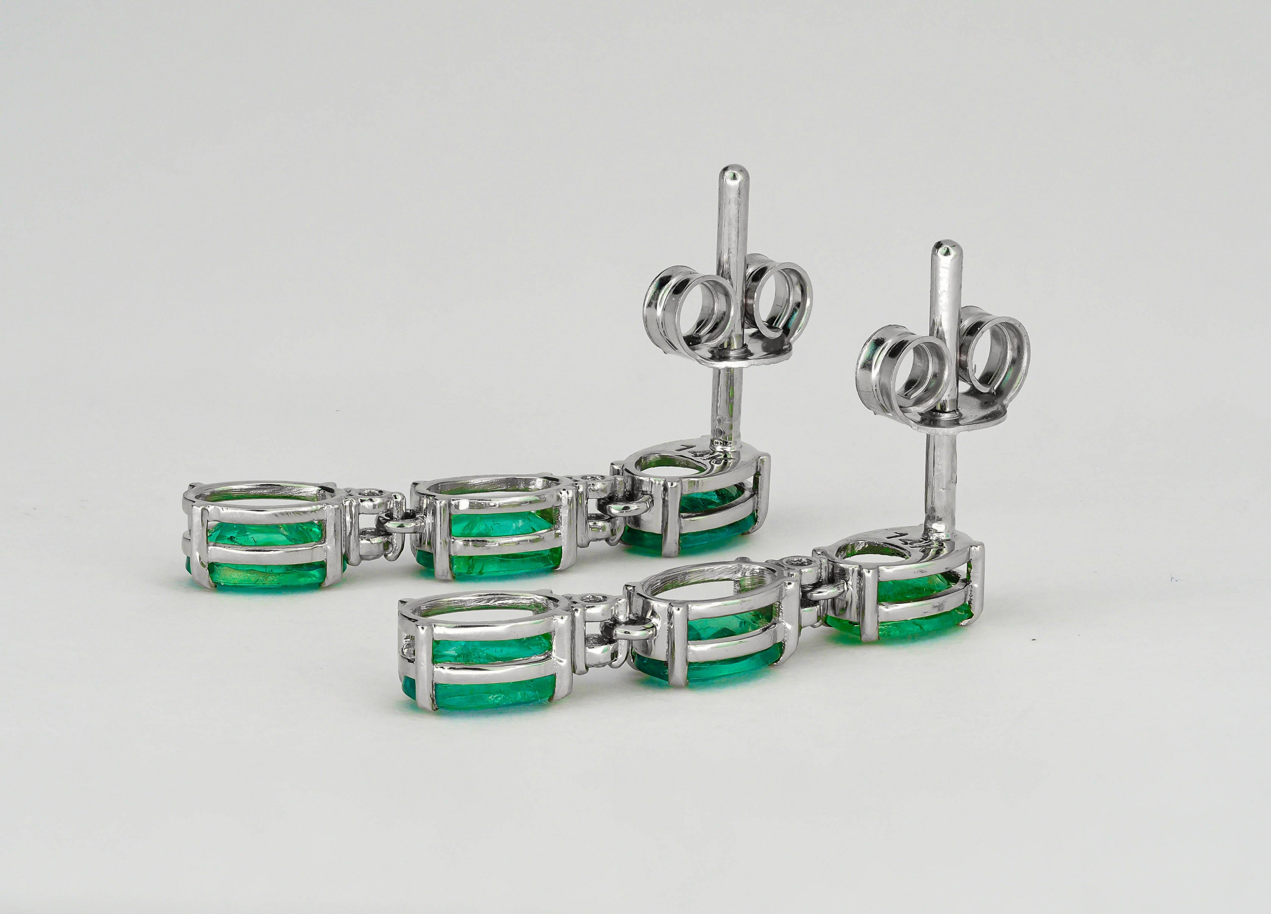 Oval Cut 14 Karat Gold Earrings Studs with Oval Emeralds. Emerald earrings studs.  For Sale