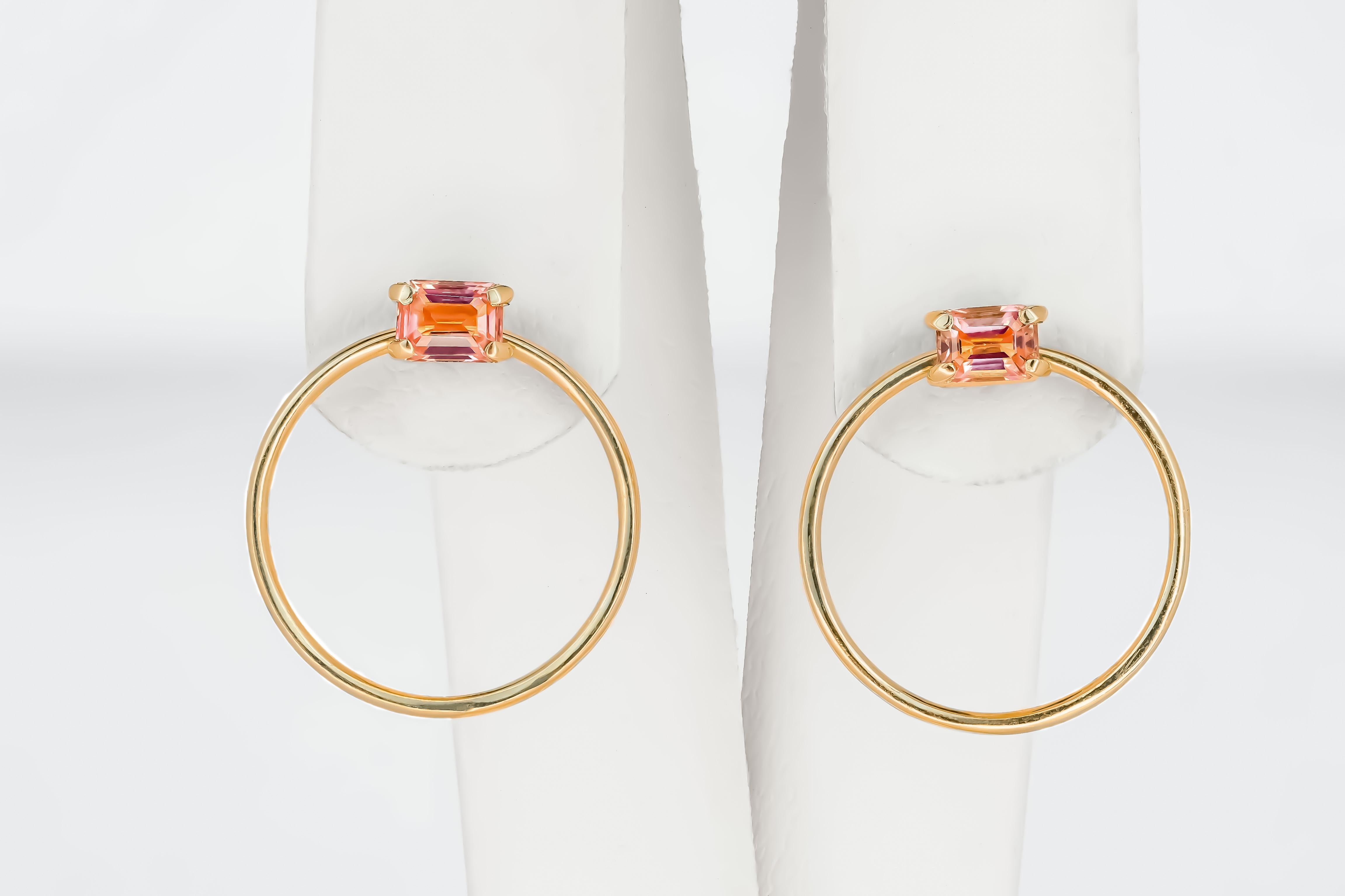 14k gold earrings studs with sapphires

metal: 14k gold , no hallmark tested in lab
weight: 2.1 gr
size: 16.5x16.5mm
set with sapphires: peach-pink color, baguette cut, clarity good - small inclusions, 0.20x2=0.40 ct total
 Earrings goes with a