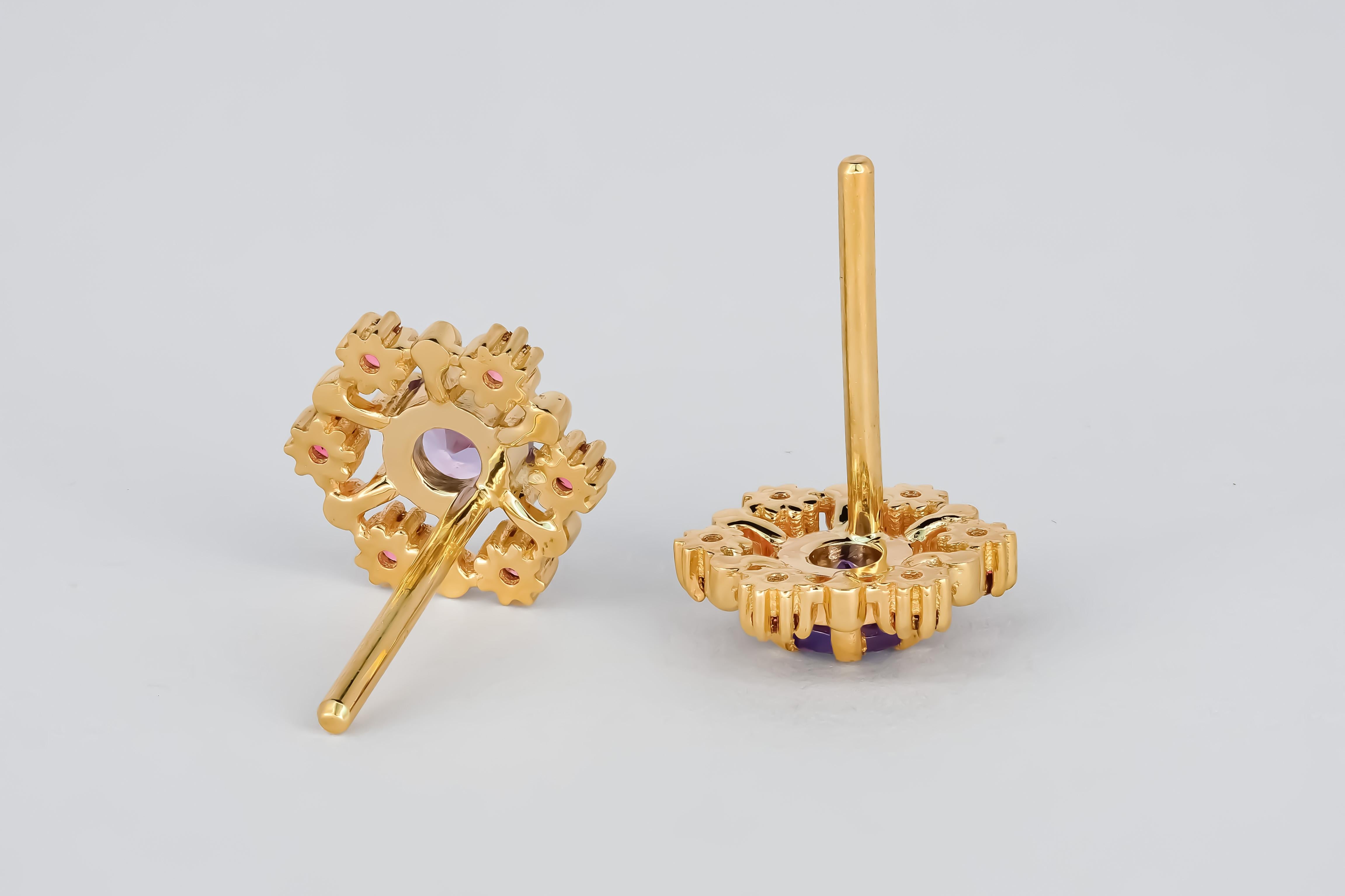 14k gold earrings studs with tanzanites and rubies

metal: 14k gold 
weight: 1.9 gr
size: 10x10mm
set with tanzanites: blue color, round cut, clarity good - small inclusions, 0.45x2=0.90 ct total
rubies: 12 pieces, round cut, red color, transparent
