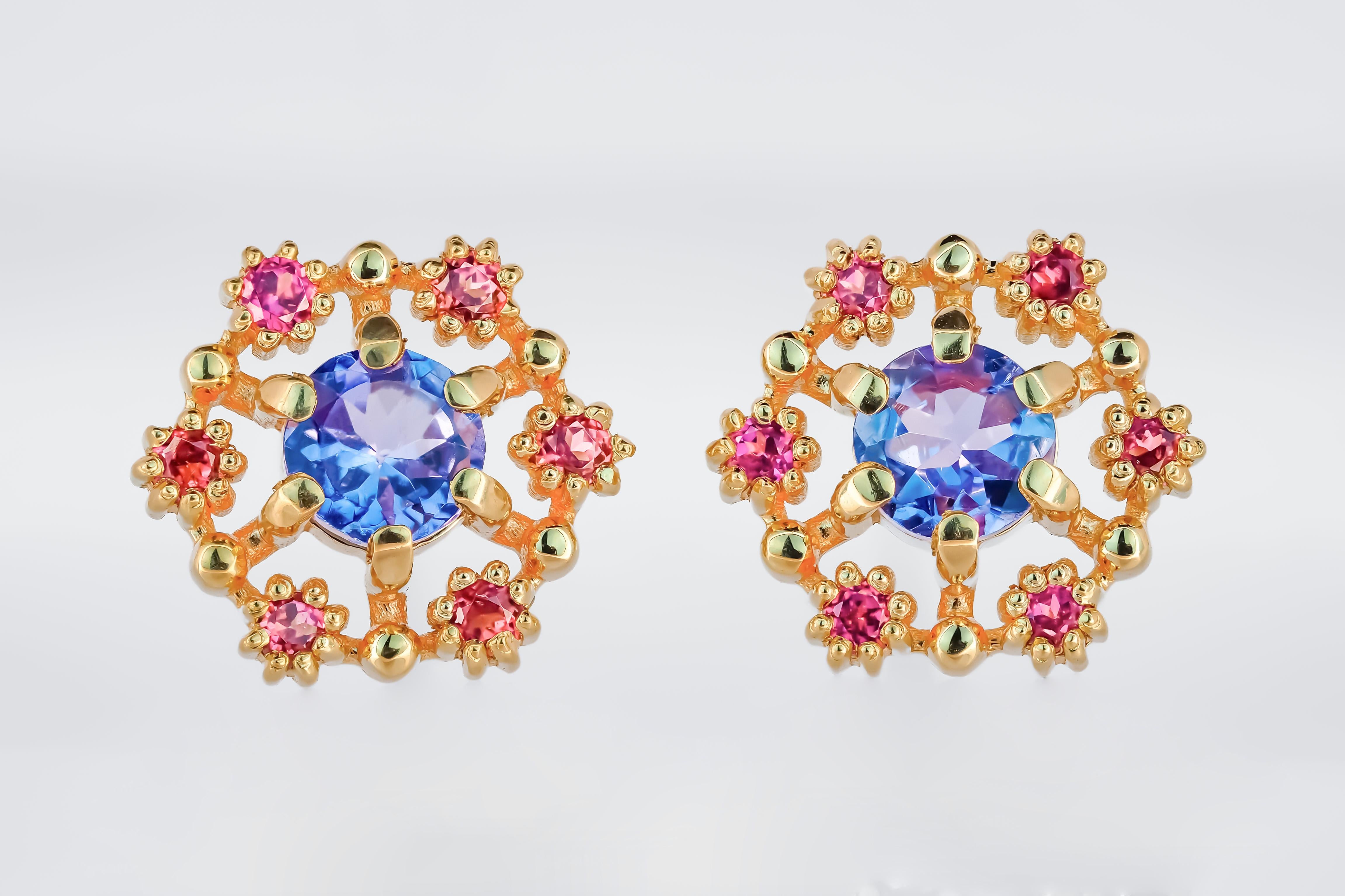 Modern 14k gold earrings studs with tanzanites and rubies