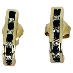 14k gold earrings with 5 blue sapphires and 5 brilliant cut diamonds