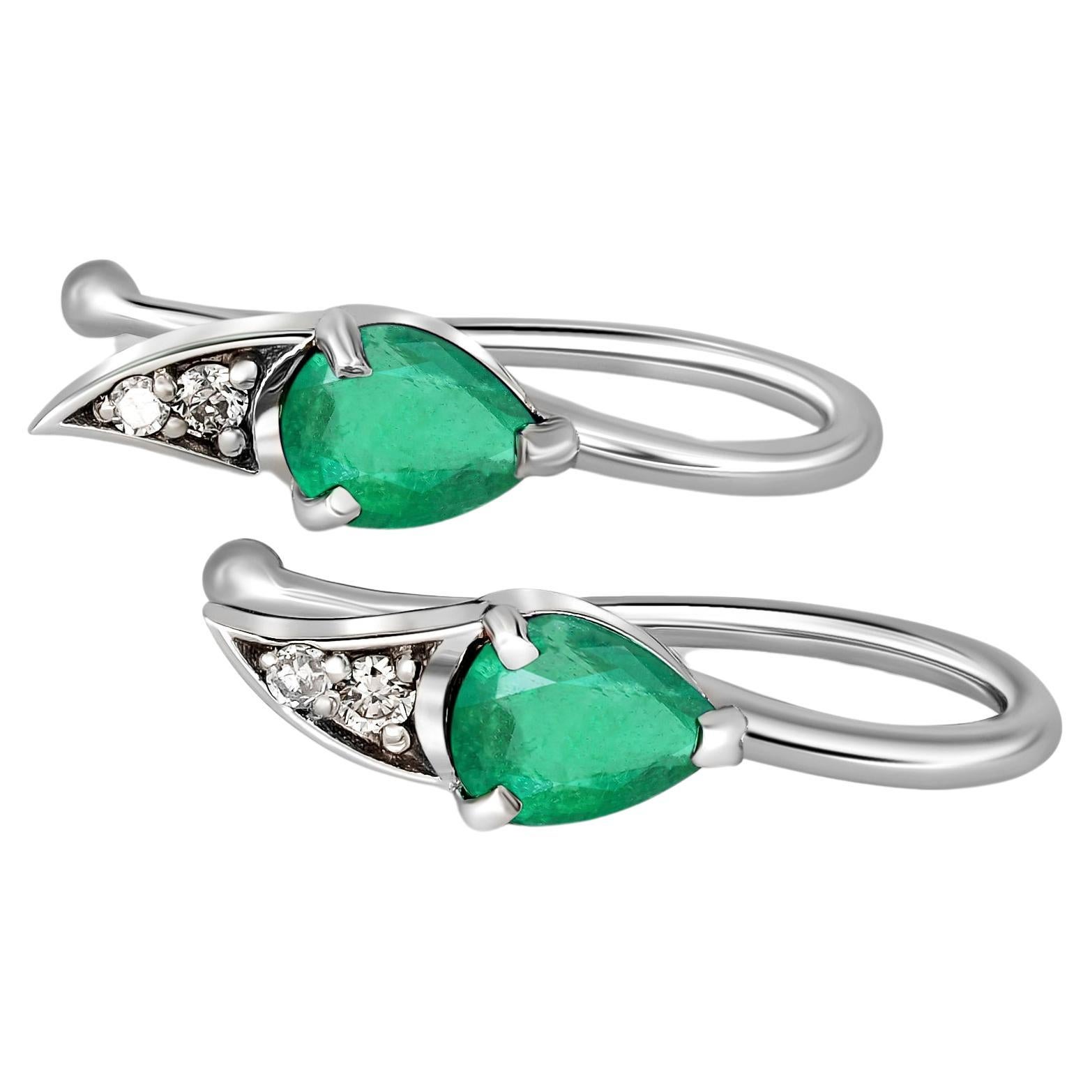 14k gold earrings with natural emerald and diamonds. For Sale