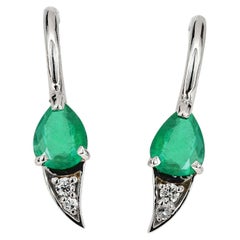 14k gold earrings with natural emerald and diamonds. 